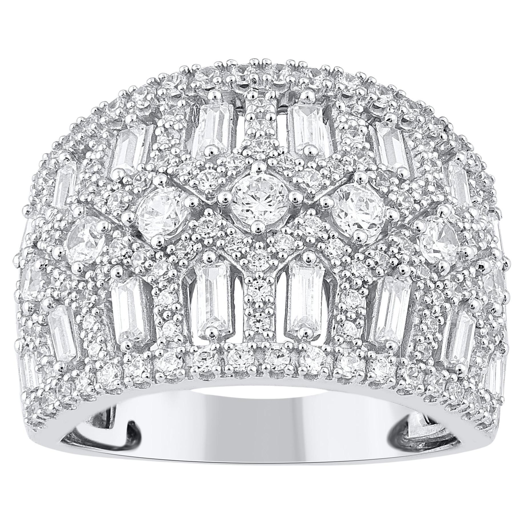 Honor the women you love with this designer diamond band. These diamond ring are studded with 145 single cut, brilliant cut and baguette diamonds in prong setting and crafted in 14kt white gold. The white diamonds are graded as H-I color and I2
