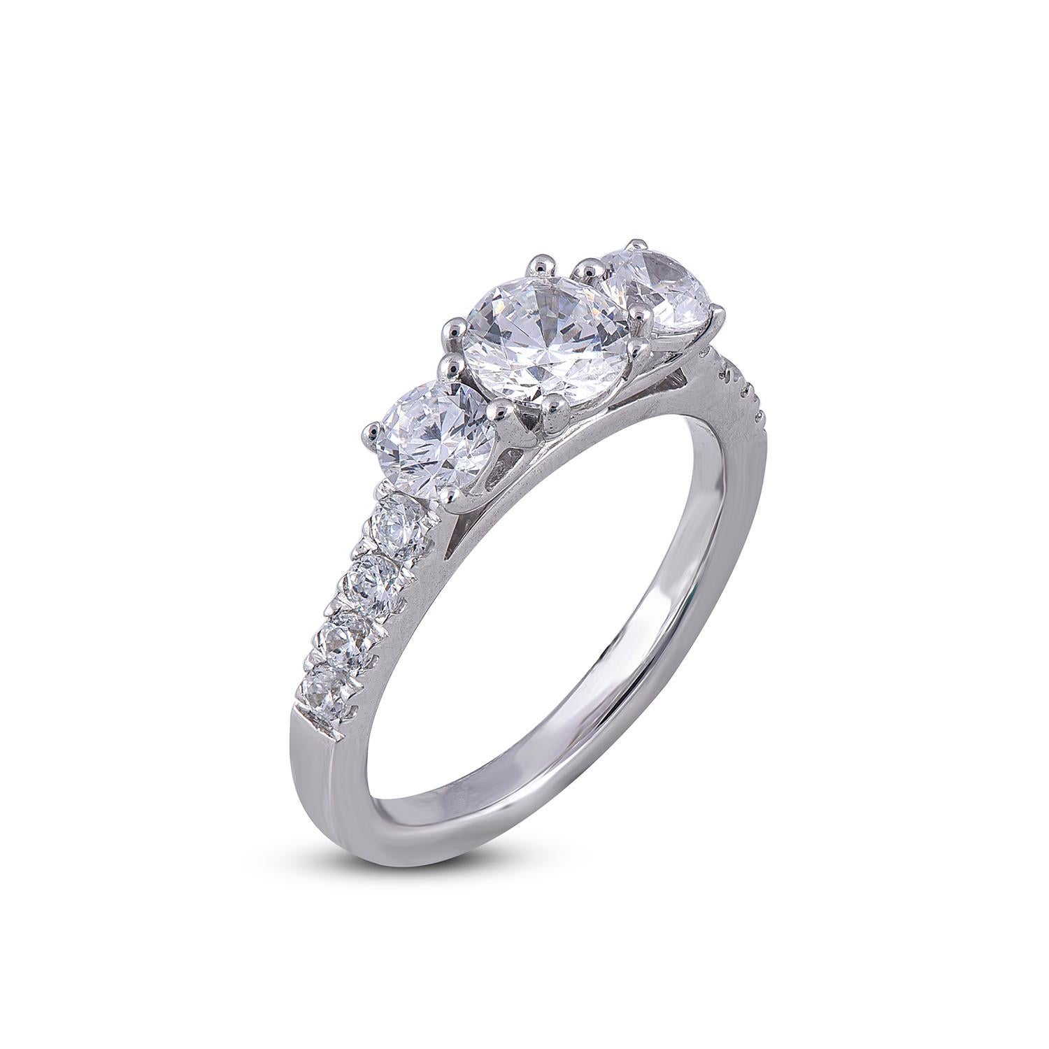 This 3 stone ring shines bright with 3 center stone and handcrafted in 18 karat White gold. it features 11 diamonds 0.75ct of centre stone and each side diamond is 0.30 ct and remaining diamond on shank lined secured in prong setting. Diamonds are