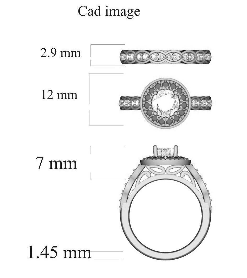 Dieser breite Ring mit geteiltem Schaft ist fachmännisch aus 18 Karat Weißgold gefertigt und verfügt über einen 1,00-karätigen Mittelstein und 0,75-karätige Diamanten, die in Mikropflaster- und Zackenfassungen eingefasst sind. Die Diamanten sind