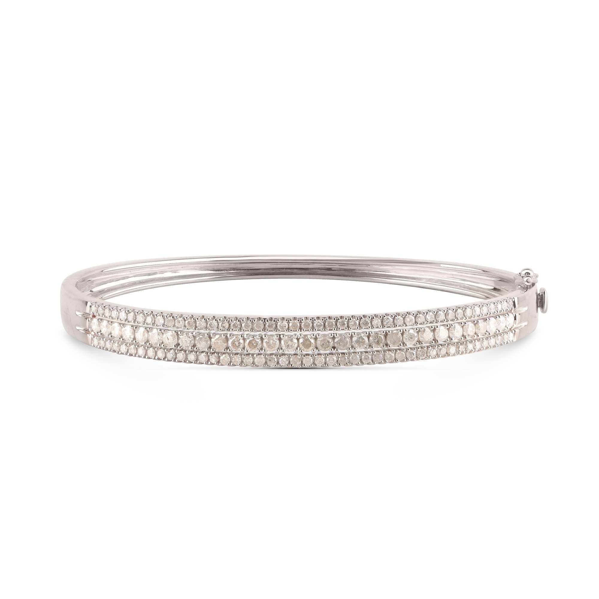This classic diamond bangle is handcrafted by our in-house craftsmen in 14-karat white gold and studded with 115 brilliant-cut diamonds in prong setting. The diamonds are graded H-I Color, I2 Clarity.
