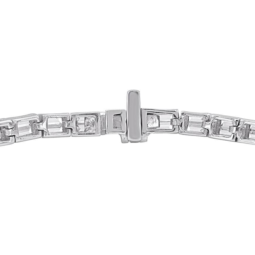 A graceful addition to her wardrobe, this diamond tennis bracelet brings the perfect touch of sparkle to her look. Beautifully hand-crafted by our inhouse experts in 18 karat white gold and embedded with 92 baguette cut diamond in channel setting.