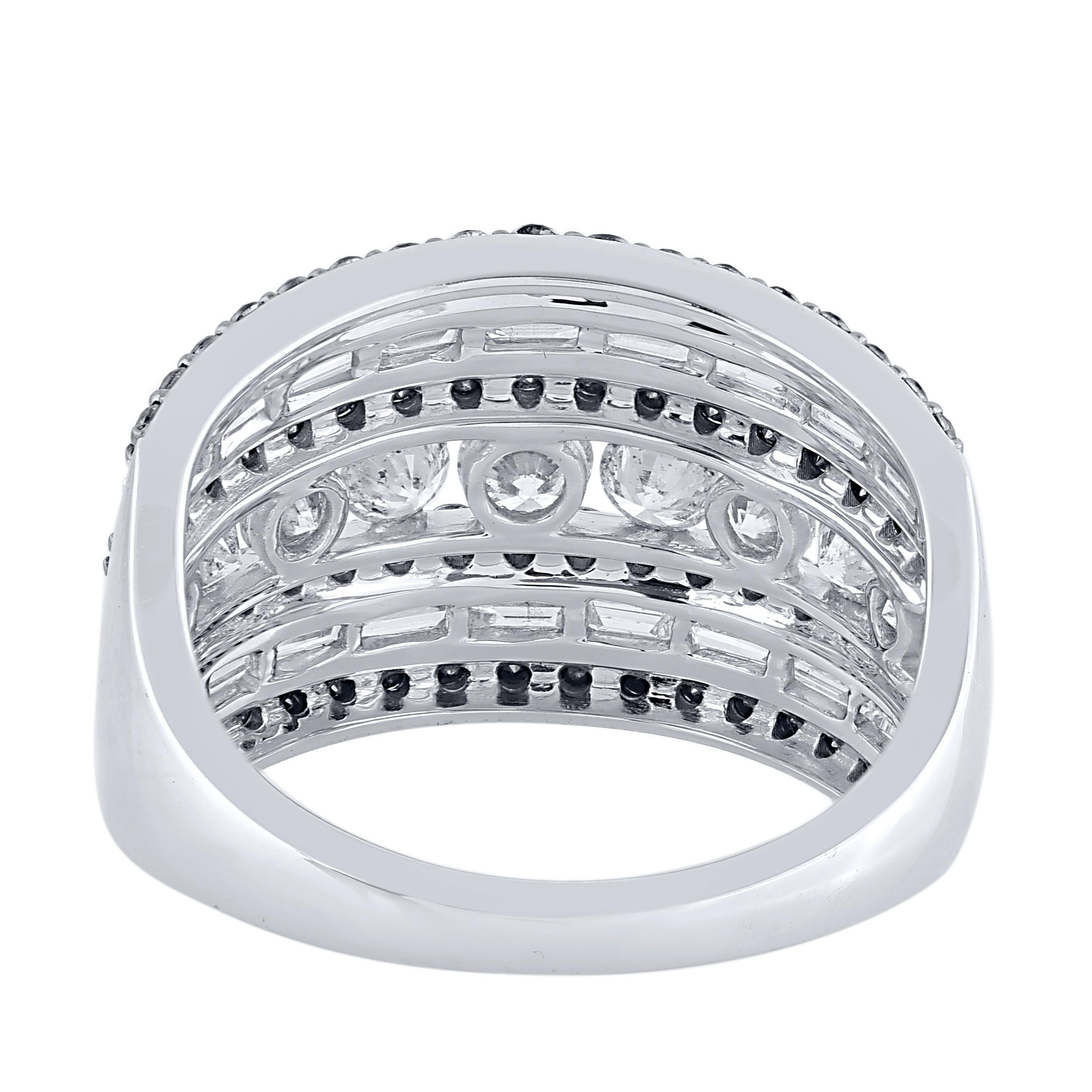 This beautiful multi row wide band ring features shimmering baguette, brilliant cut diamonds and treated black diamond in prong & channel setting. Crafted in 14 karat white gold. The ring is studded with a total of 95 brilliant cut natural round