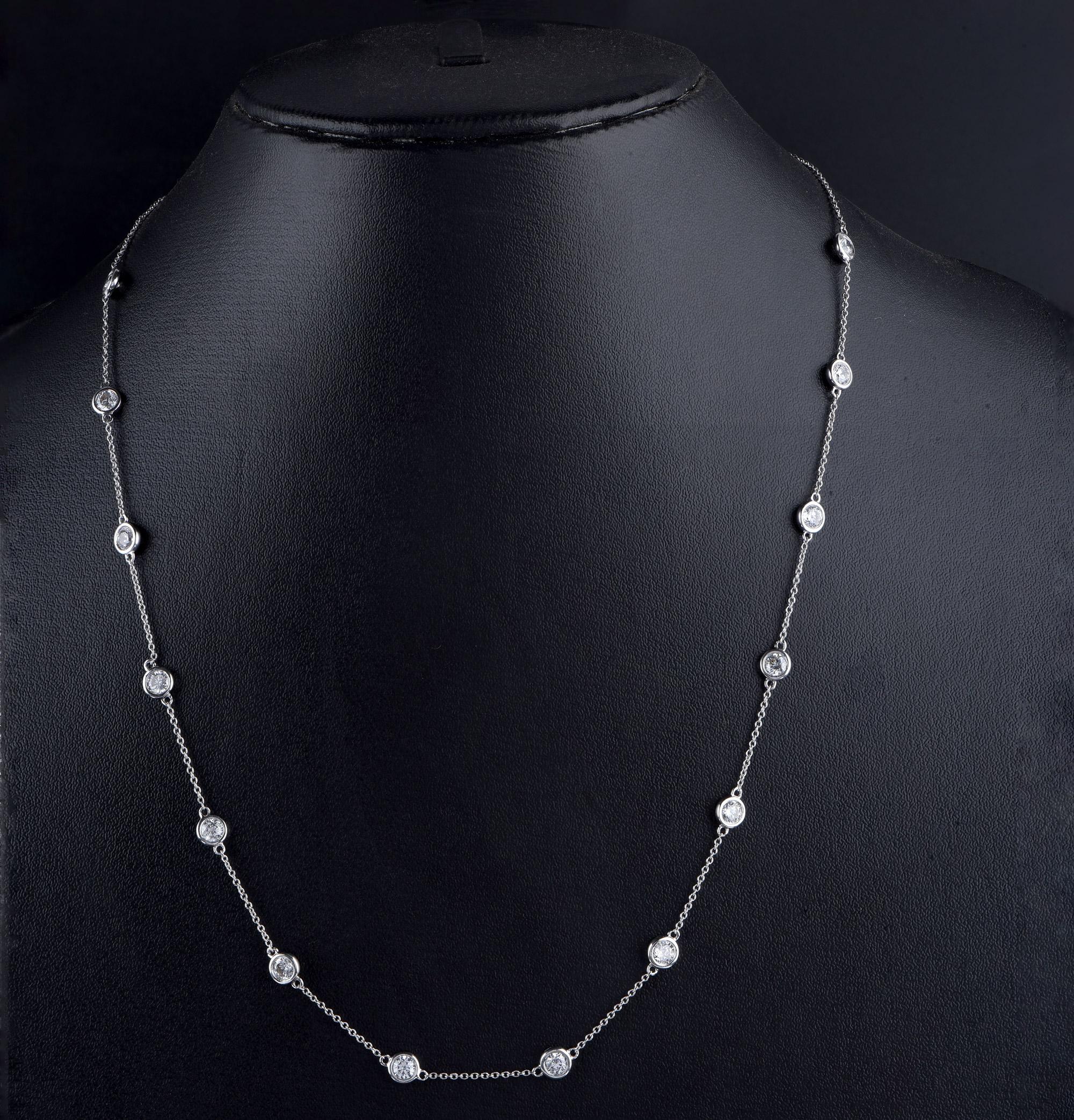 Elegantly designed with 14 brilliant cut diamonds beautifully set in bezel setting and made by our skillful craftsmen in 14-karat white gold. The diamonds are graded HI Colour, I2 Clarity. The length of the cable chain necklace is 18 inches.