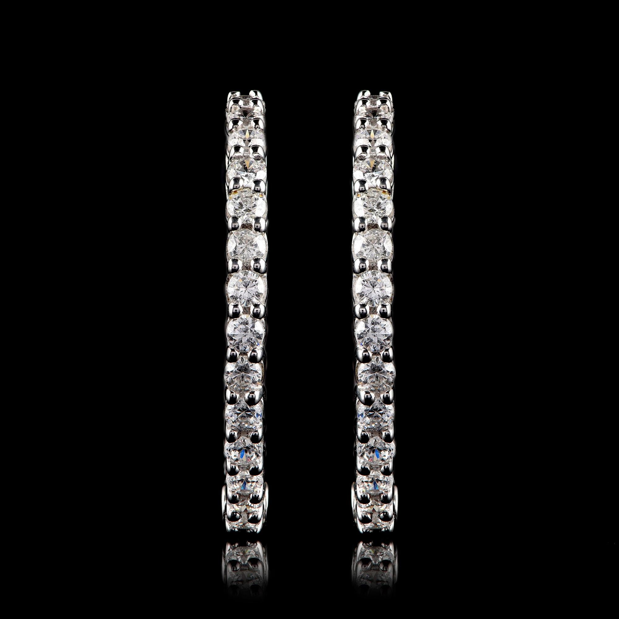 This classic design features 68 brilliant-cut diamonds in prong setting. Made by our skillful craftsmen in 18-karat white gold. The diamonds are graded H-I Color, I2 Clarity.