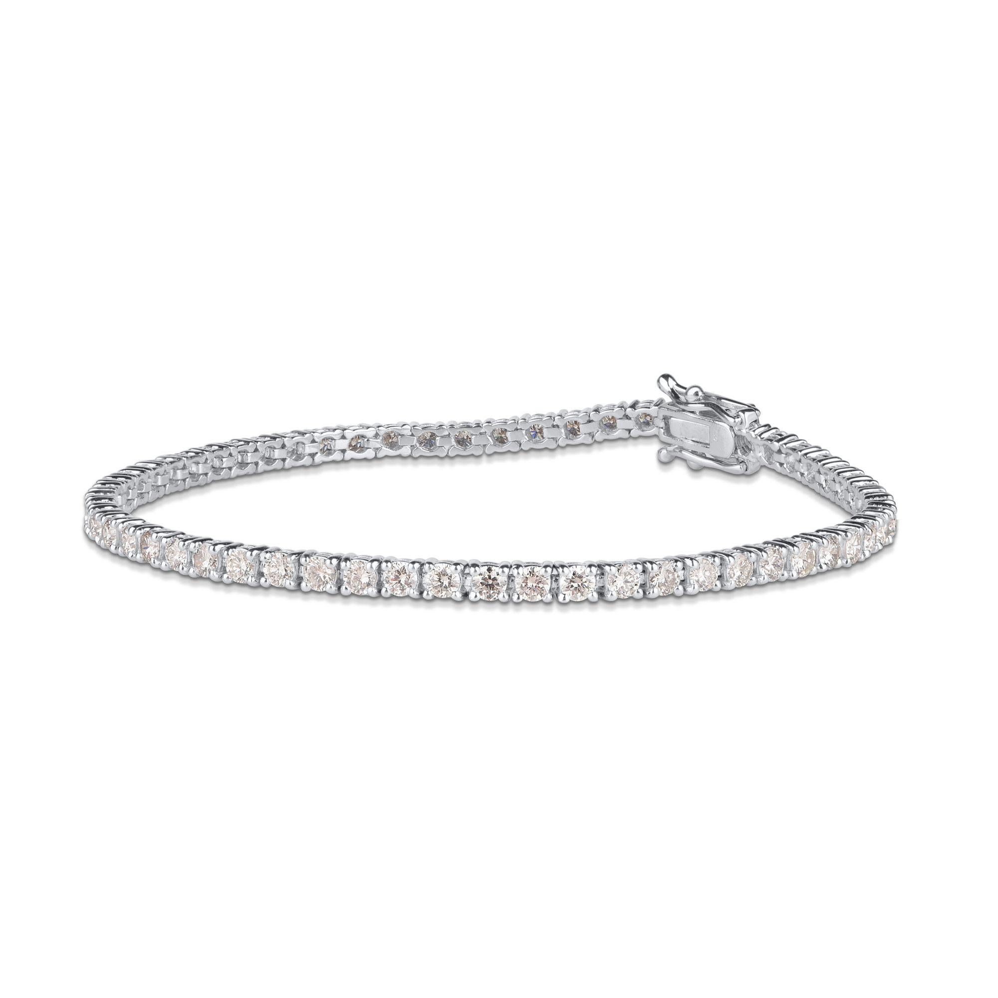 A classic look just for her, this diamond tennis bracelet is certain to take her breath away. Dazzles with 81 round brilliant-cut diamond set beautifully in prong setting and crafted by our experts in 14 karat white gold. The total weight of diamond