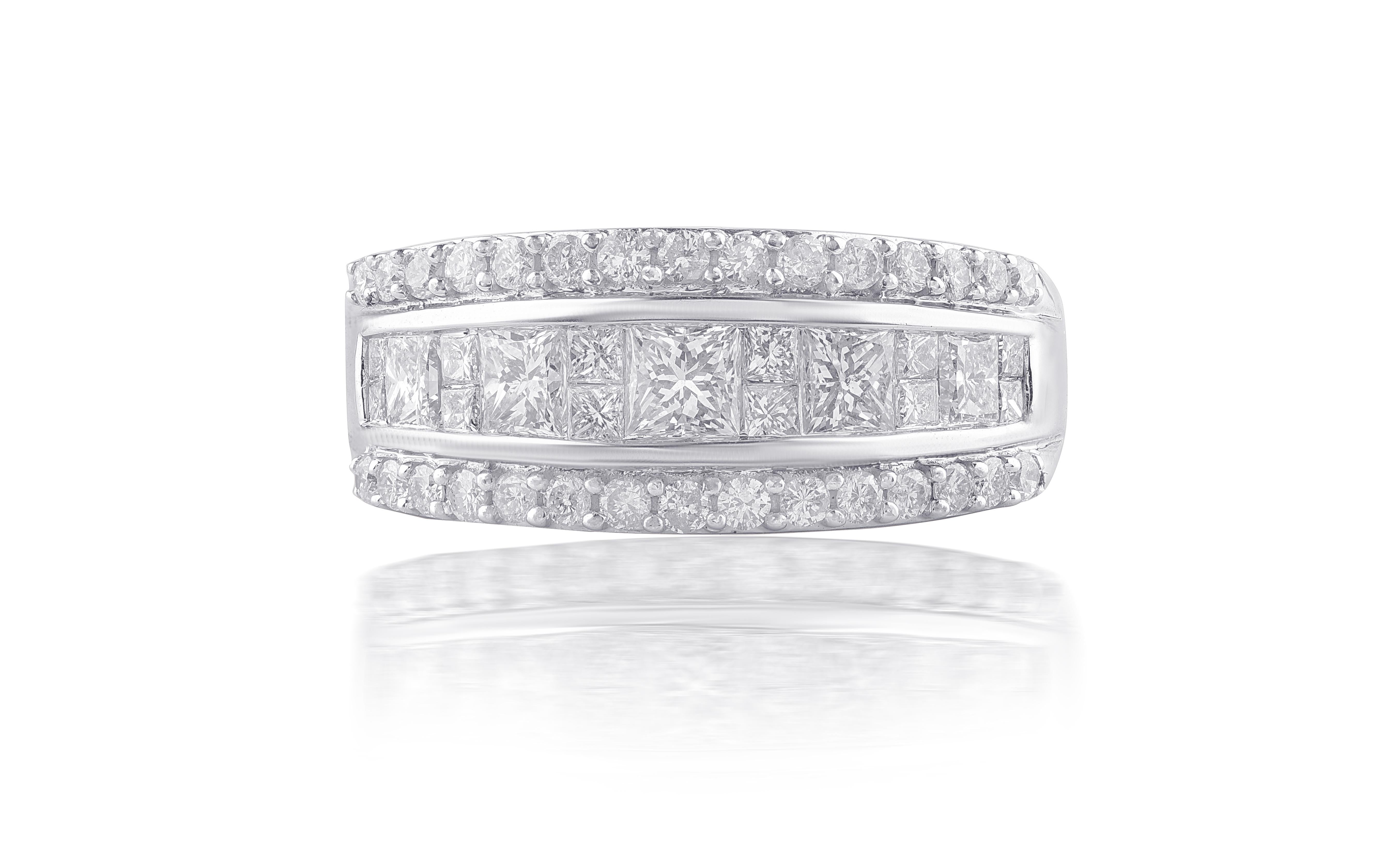 A timeless natural diamond ring crafted in 10 kt white gold. This eternity band is studded with 30 round and 17 princess cut diamonds in prong and channel setting and it comes along with an authentication certificate. Diamonds are graded H-I Color,