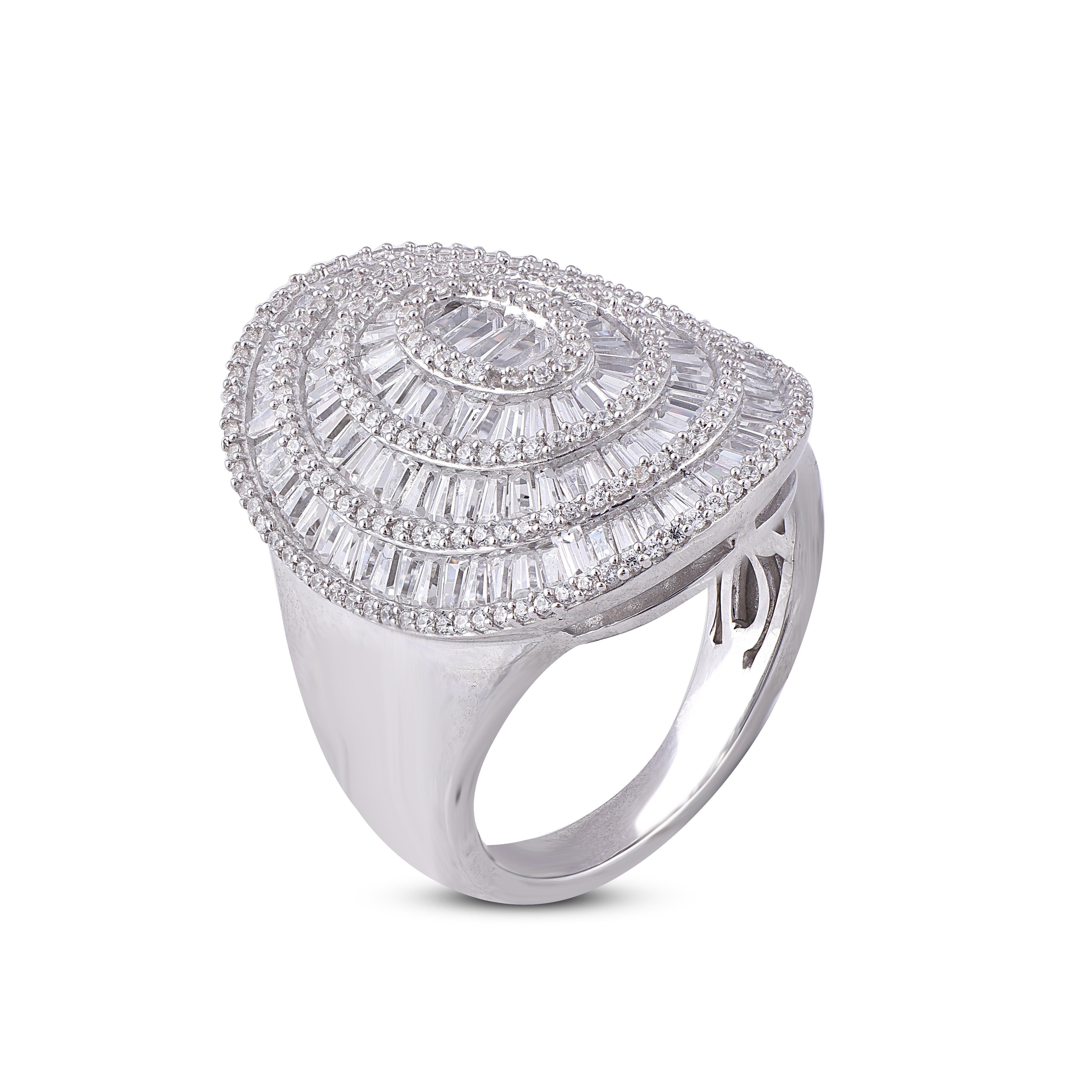 Truly exquisite, this Designer diamond disc ring is sure to be admired for the inherent classic beauty and elegance within its design. This engagement ring features 2.00 carat of 196 round and 143 Baguette diamond studded in prong and channel