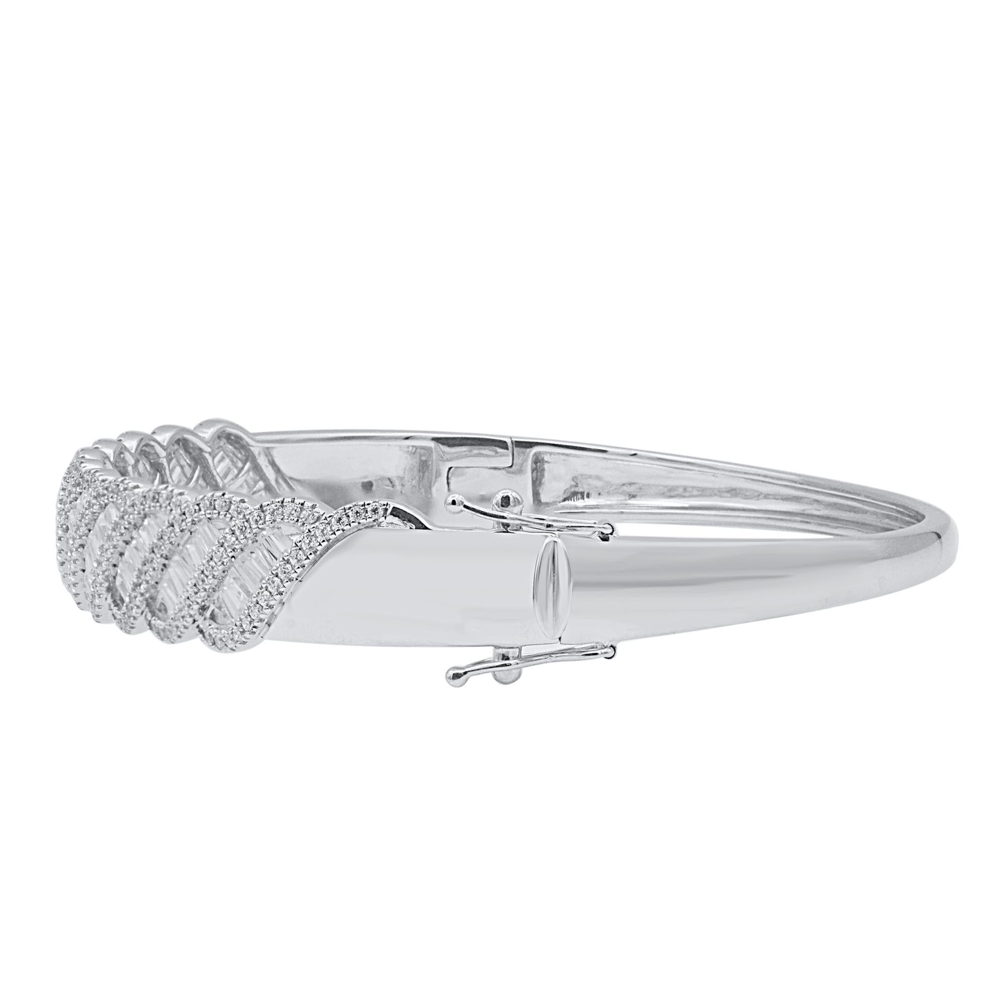 Classic and sophisticated, this diamond bangle bracelet pairs well with any attire.
This Shimmering bangle features 267 natural single cut & baguette diamonds in prong and Channel setting and crafted in 18 kt white gold. Diamonds are graded H-I