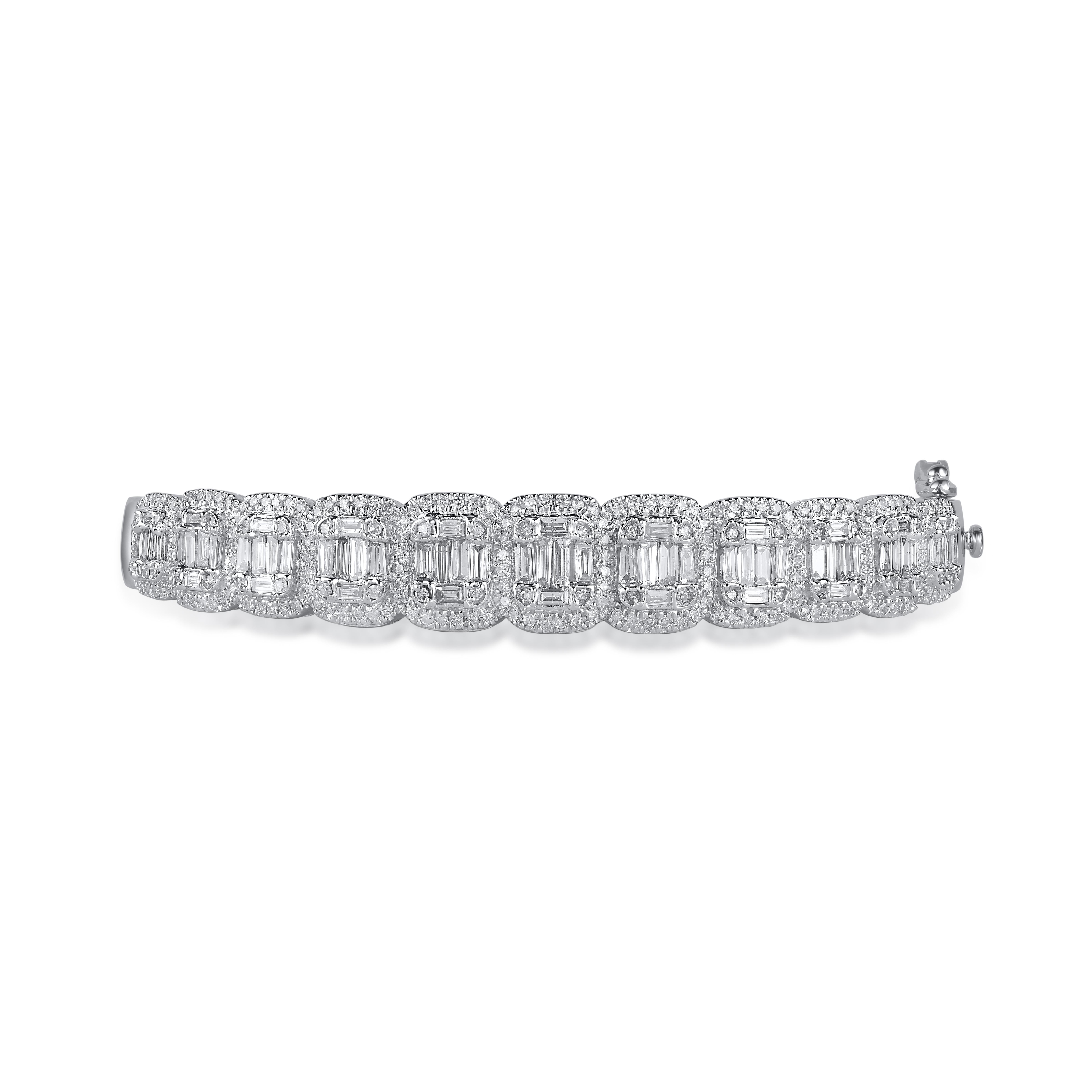 This Shimmering bangle features 312 round and baguette diamonds in pave and channel setting and crafted 14 kt white gold. 
The diamonds are graded Round (H-I Color, I2 Clarity) and Baguette (G-H Color, I1 Clarity) Make you look truly resplendent