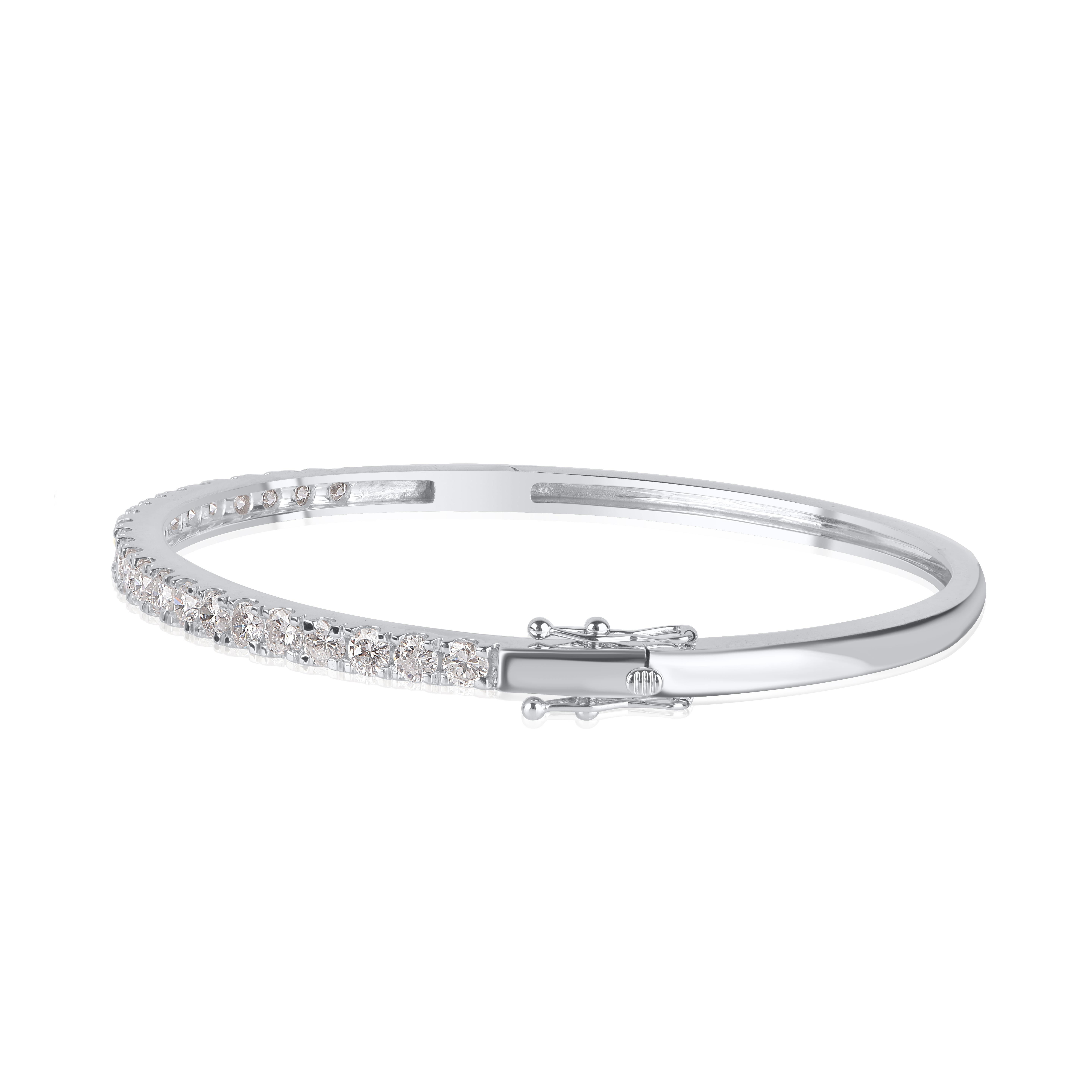 Shimmering, sleek and streamlined, this dazzling diamond bangle is perfect for day or evening wear. This classic design crafted in 10 KT white gold, featuring 23 round-cut diamonds elegantly set in micro-prong setting, diamonds are graded H-I Color,