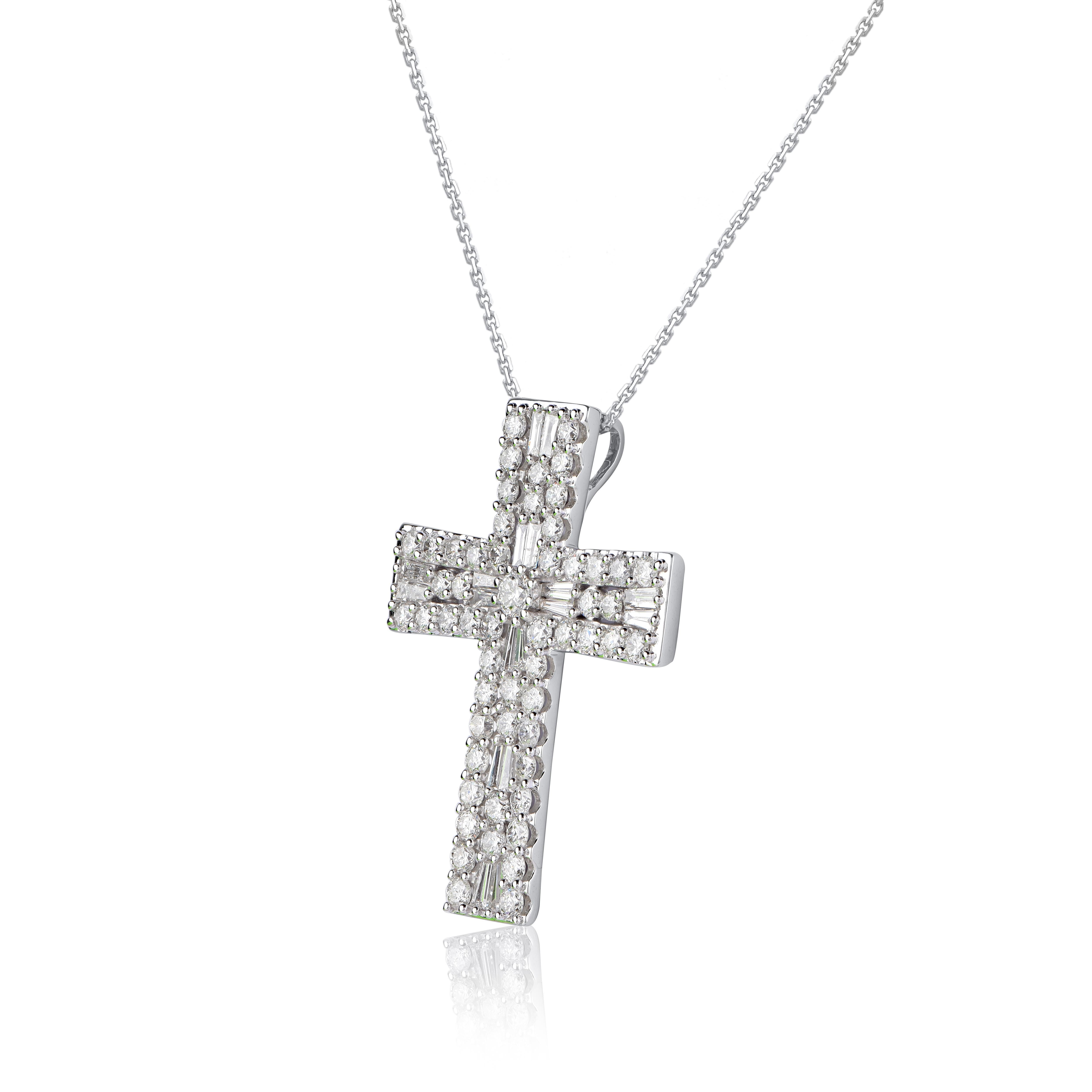 Make a bold statement of style and beliefs with the eye-catching elegance of this diamond cross pendant. Beautifully crafted by our inhouse experts in 14 karat white gold and embellished with 73 round brilliant cut & baguette cut diamond set in