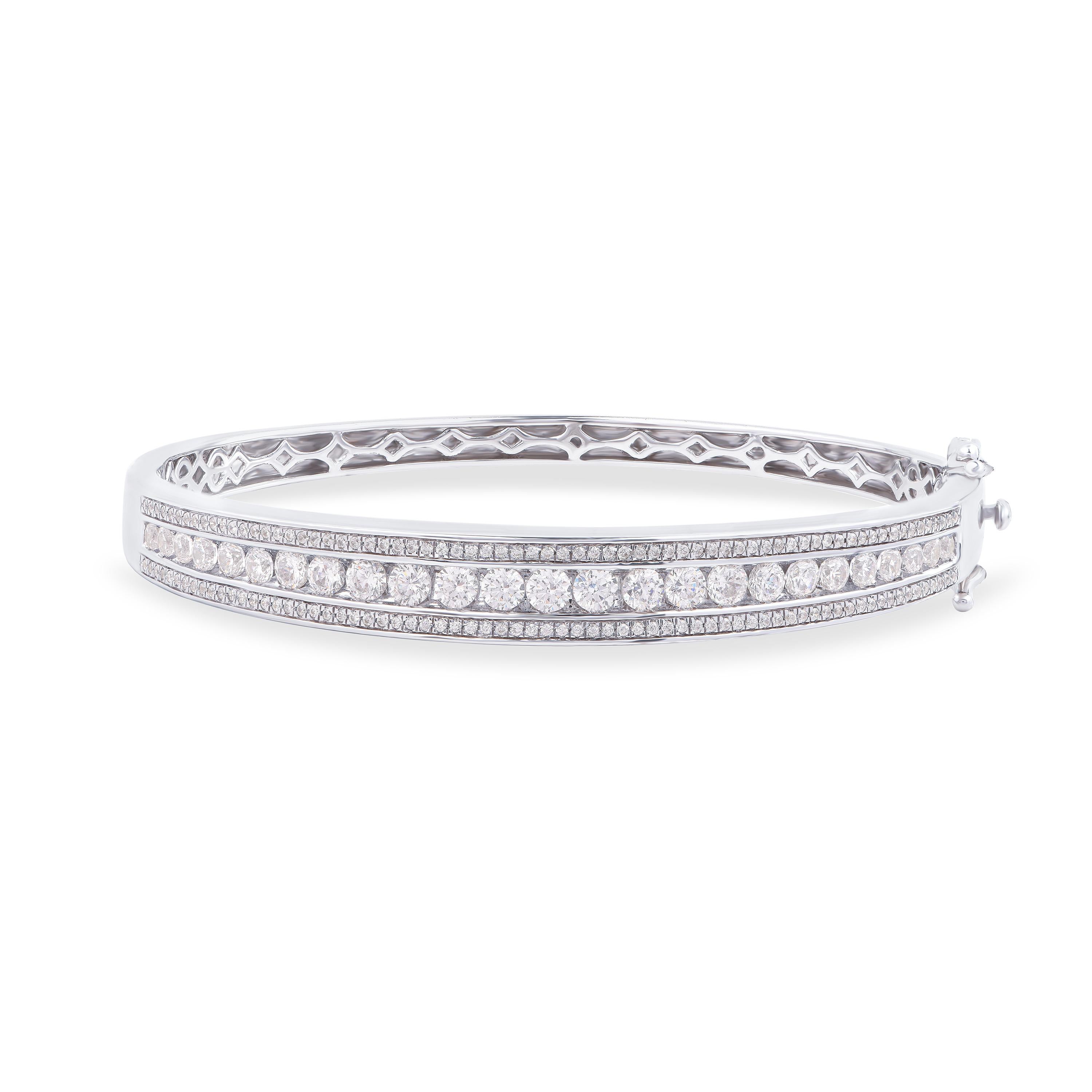 Scintillating with 163 brilliant-cut diamonds beautifully set in nick setting and crafted in 18-karat white gold. The diamonds are graded H-I Color, I2 Clarity. This diamond bangle is a perfect accompaniment for your evening look. 

This piece is
