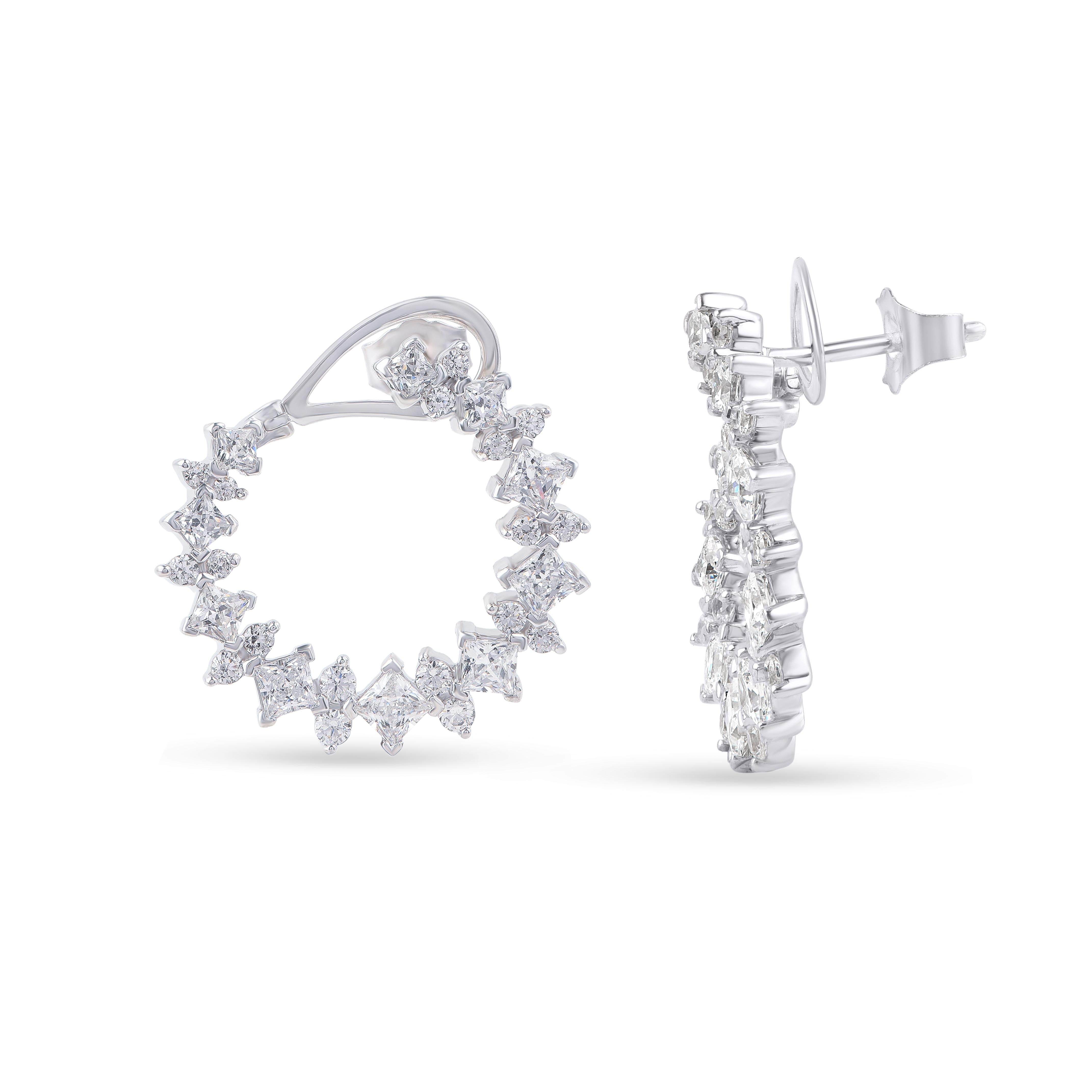 Designed by skillful craftsmen in 18-karat white gold, these diamond hoop earrings feature 36 brilliant cut and 20 princess-cut diamonds in prong setting. The diamonds are graded H-I Color, I2 Clarity. 

We can customize these earrings in yellow and