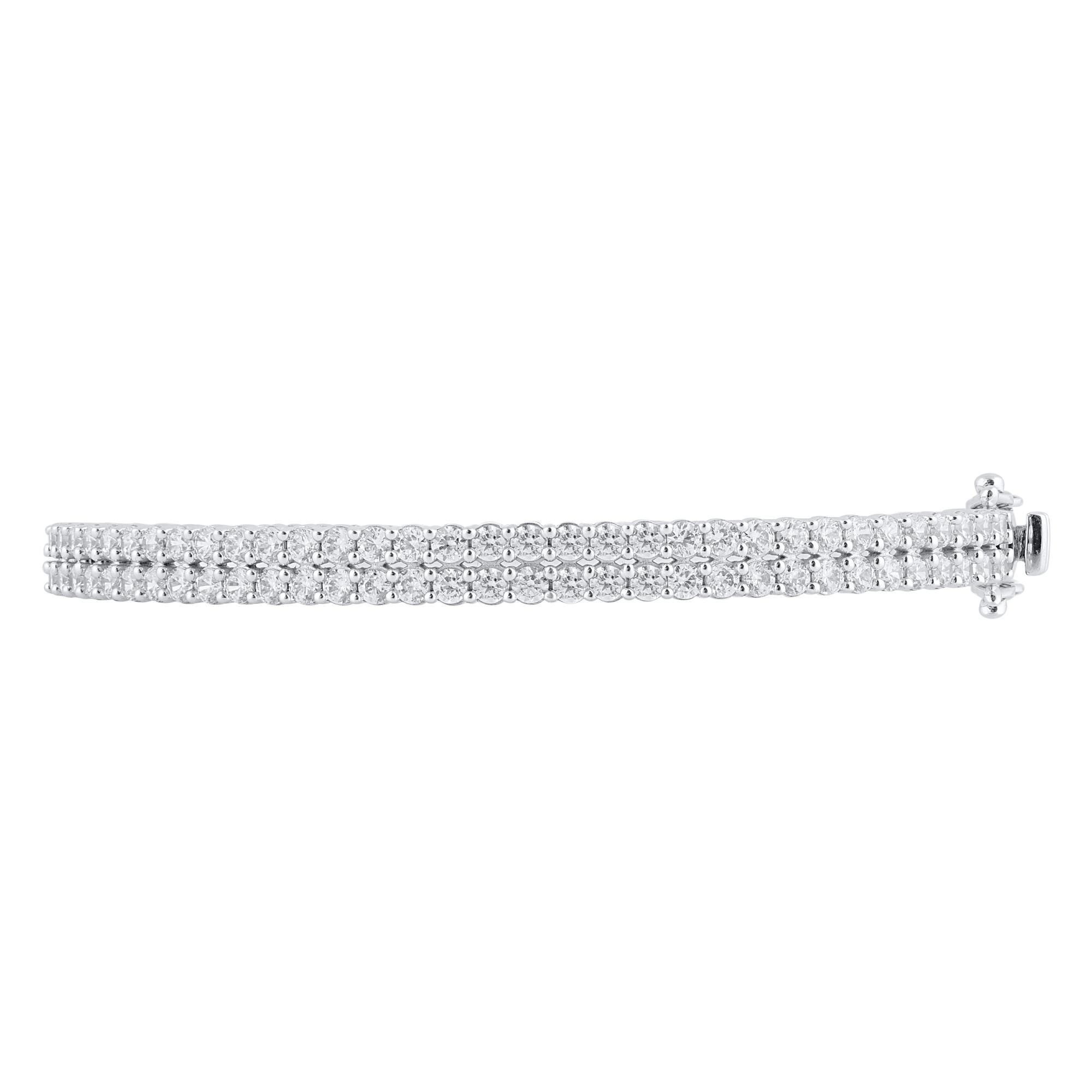 Classic and sophisticated, this diamond bangle bracelet pairs well with any attire.
This Shimmering bangle features 66 rounds natural diamonds in prong setting and crafted 14 kt white gold. Diamonds are graded H-I color, I2 clarity. 

