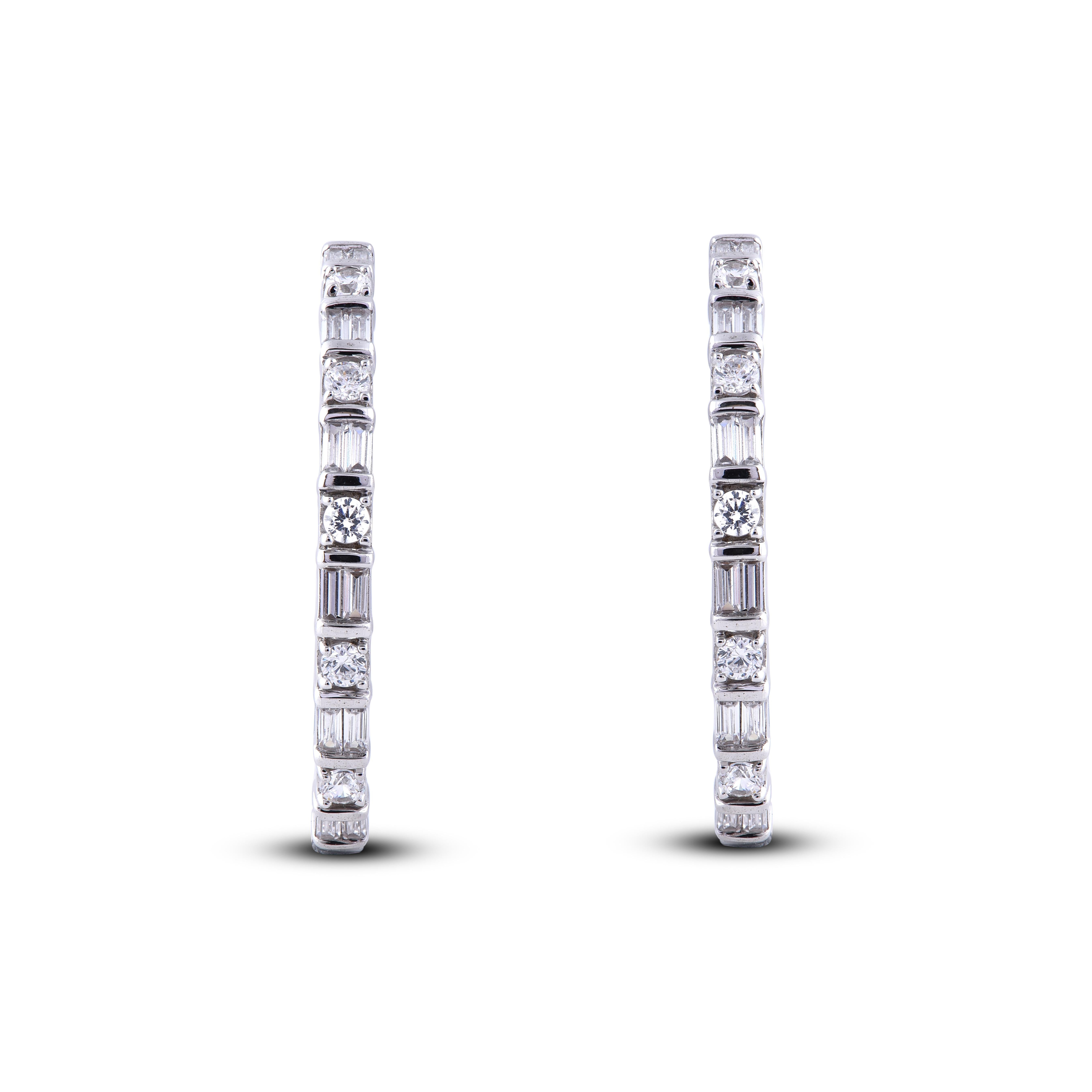 Modern and mesmerizing, these diamond hoop earrings are an eye catchy look for any occasion. Embedded with 18 round and 44 Baguette cut diamonds set in prong and channel setting and dazzles in H-I color I2 clarity. Crafted by our inhouse experts in