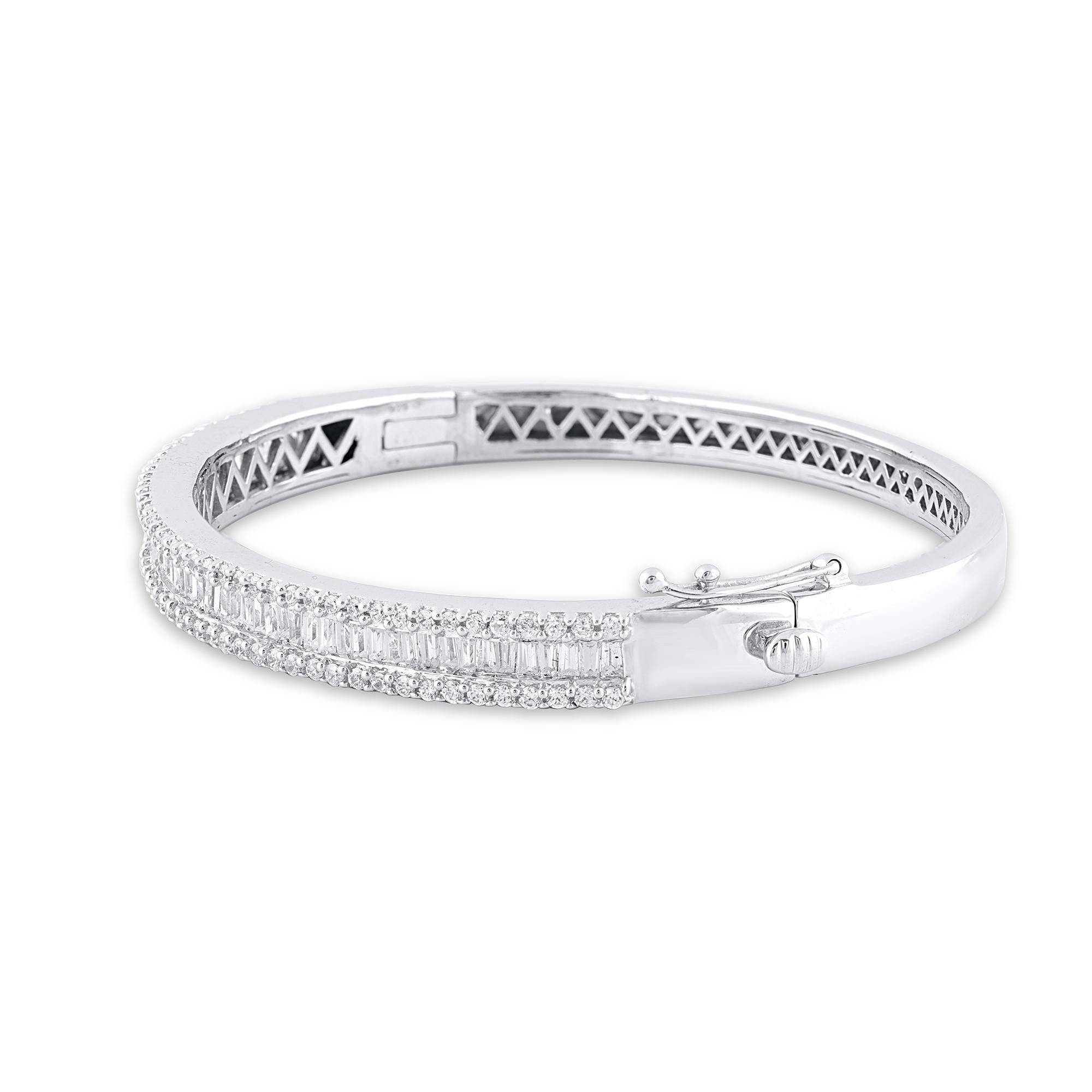 She'll love this tennis-look diamond bangle so much she won't ever want to take it off. This bangle showcase the round brilliant-cut and baguette-cut diamond in channel and bead setting and crafted by our inhouse experts in 18 karat white gold. The
