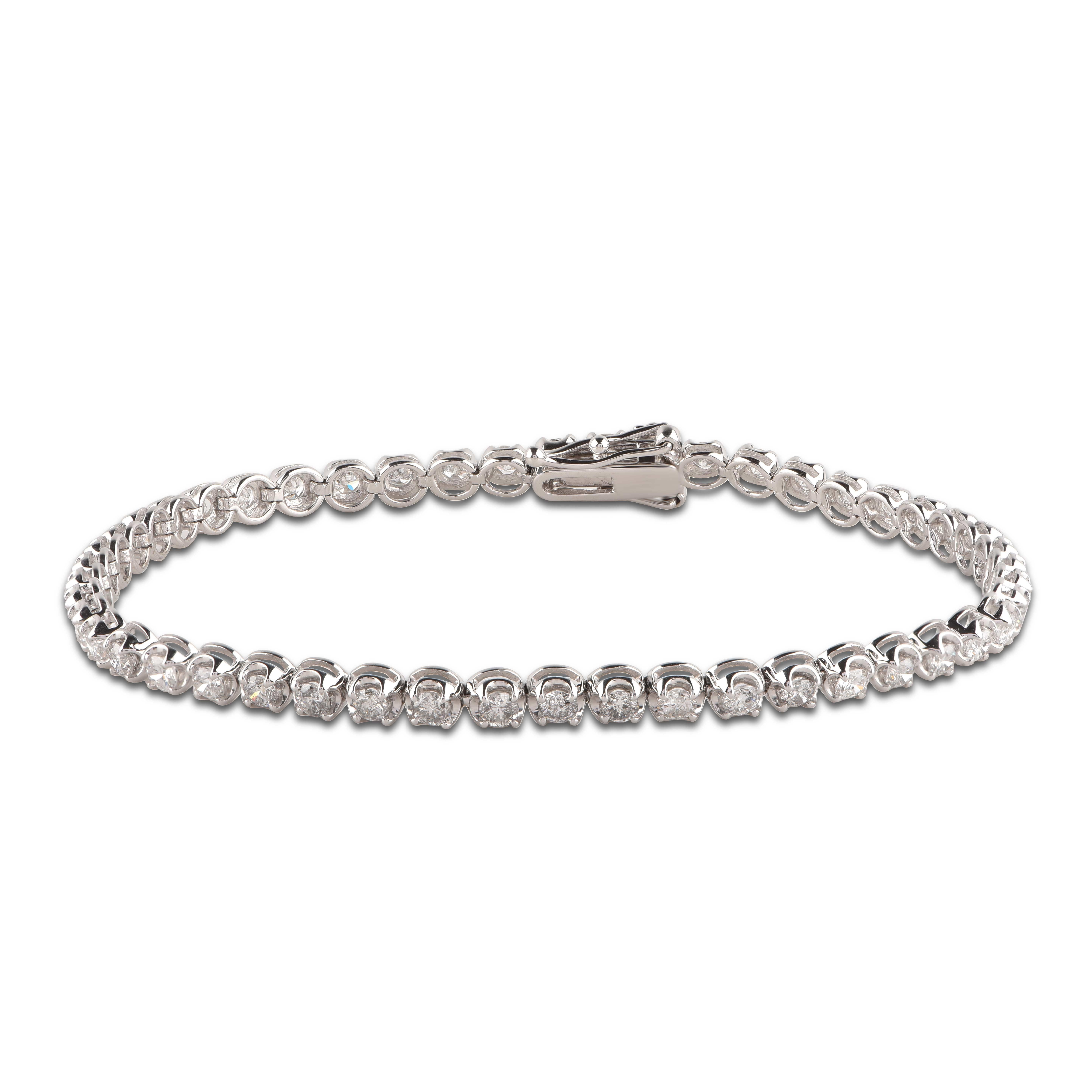Wrap her wrist in this luxury diamond tennis bracelet. Crafted to Perfection by our inhouse experts in 14 Karat White Gold and studded with 48 round brilliant-cut diamonds in prong setting. The total weight of diamond is 3.00 Carat and it shine with