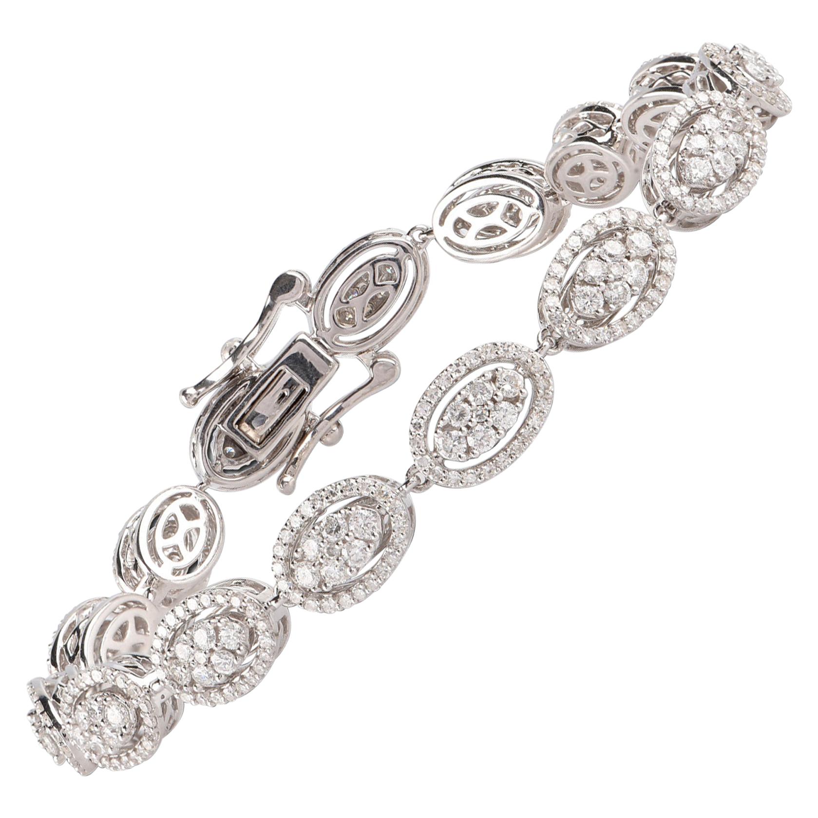 A graceful addition to her wardrobe, this diamond link bracelet brings the perfect touch of sparkle to her look. Glitters with 435 brilliant-cut diamonds set elegantly in prong setting and crafted in 14-karat white gold. Diamonds are graded H-I