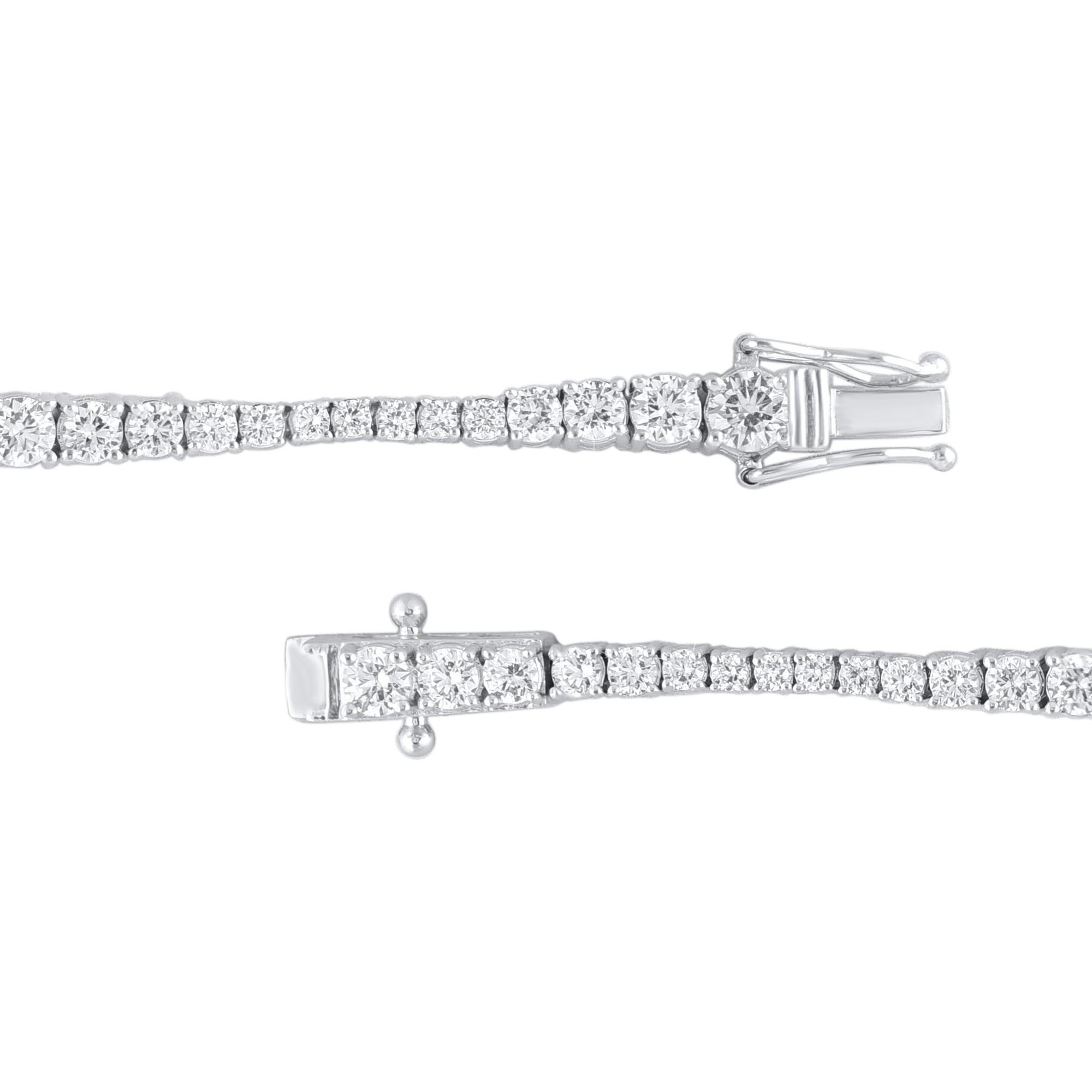 A graceful addition to her wardrobe, this diamond tennis bracelet brings the perfect touch of sparkle to her look. Beautifully hand-crafted by our inhouse experts in 14 karat white gold and embedded with 64 round brilliant cut diamond in prong