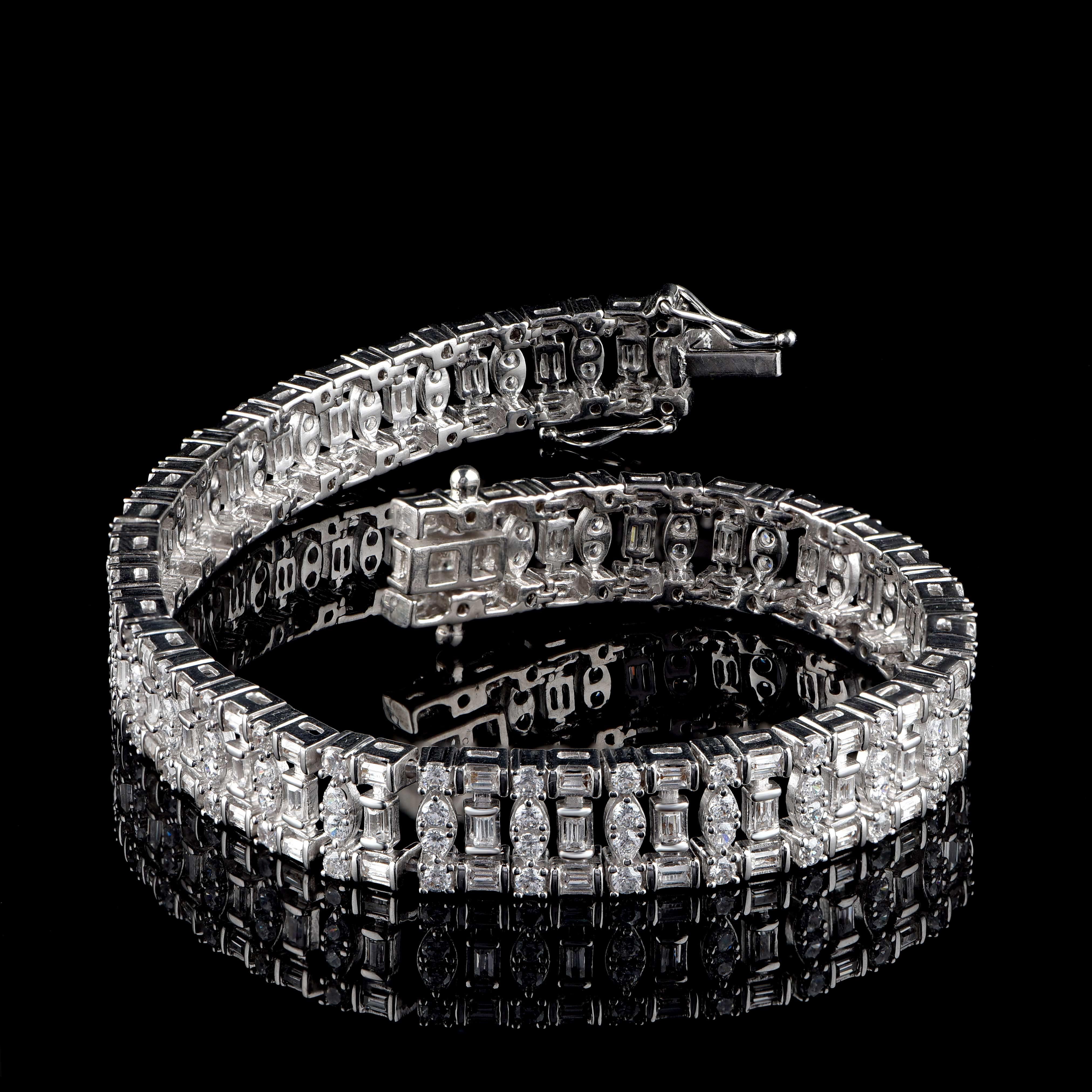 Sure to be loved, this blissful diamond bracelet simply dazzles. 
Scintillating with 350 brilliant cut and baguette-cut diamonds beautifully set in prong and channel setting and crafted in 18kt white gold. The total diamond weight is 5.0 carats and