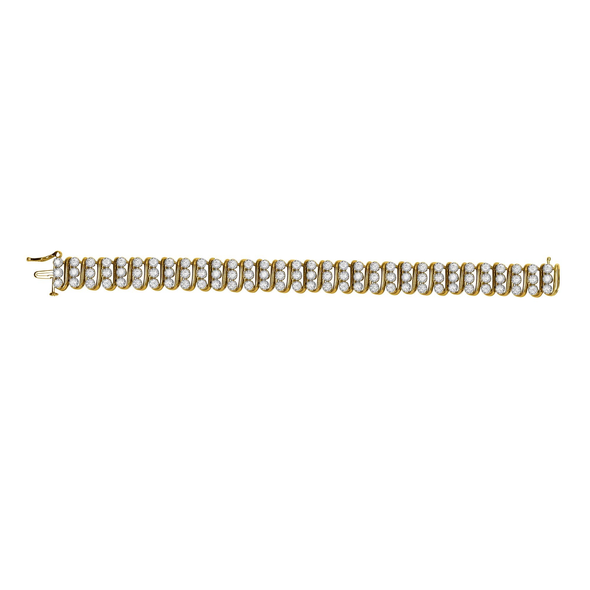 Avec sa cascade de brillants, ce bracelet en diamants attire tous les regards. Réalisé en or jaune 14 carats, ce bijou présente des maillons en forme de S et 96 diamants ronds de taille brillant en serti clos. Le poids total du diamant est de 5,00