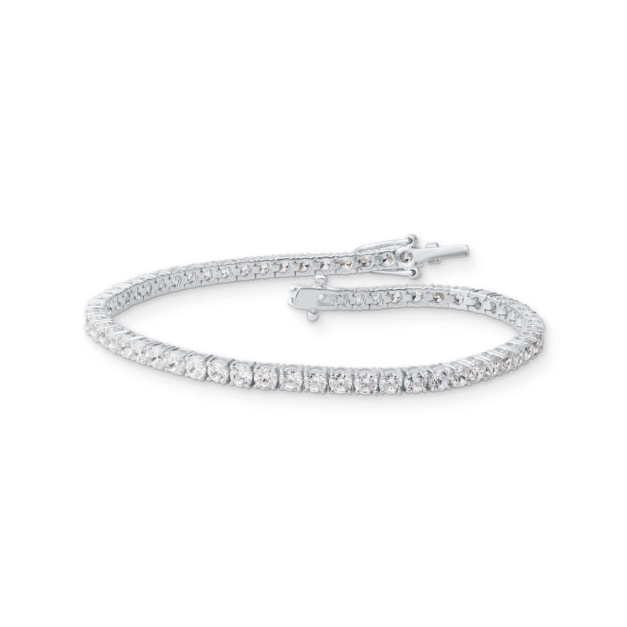 Wrap her wrist in this luxury diamond tennis bracelet. Crafted to Perfection by our inhouse experts in 14 Karat White Gold and studded with 62 round brilliant-cut diamonds in prong setting. The total weight of diamond is 5.00 Carat and it shine with