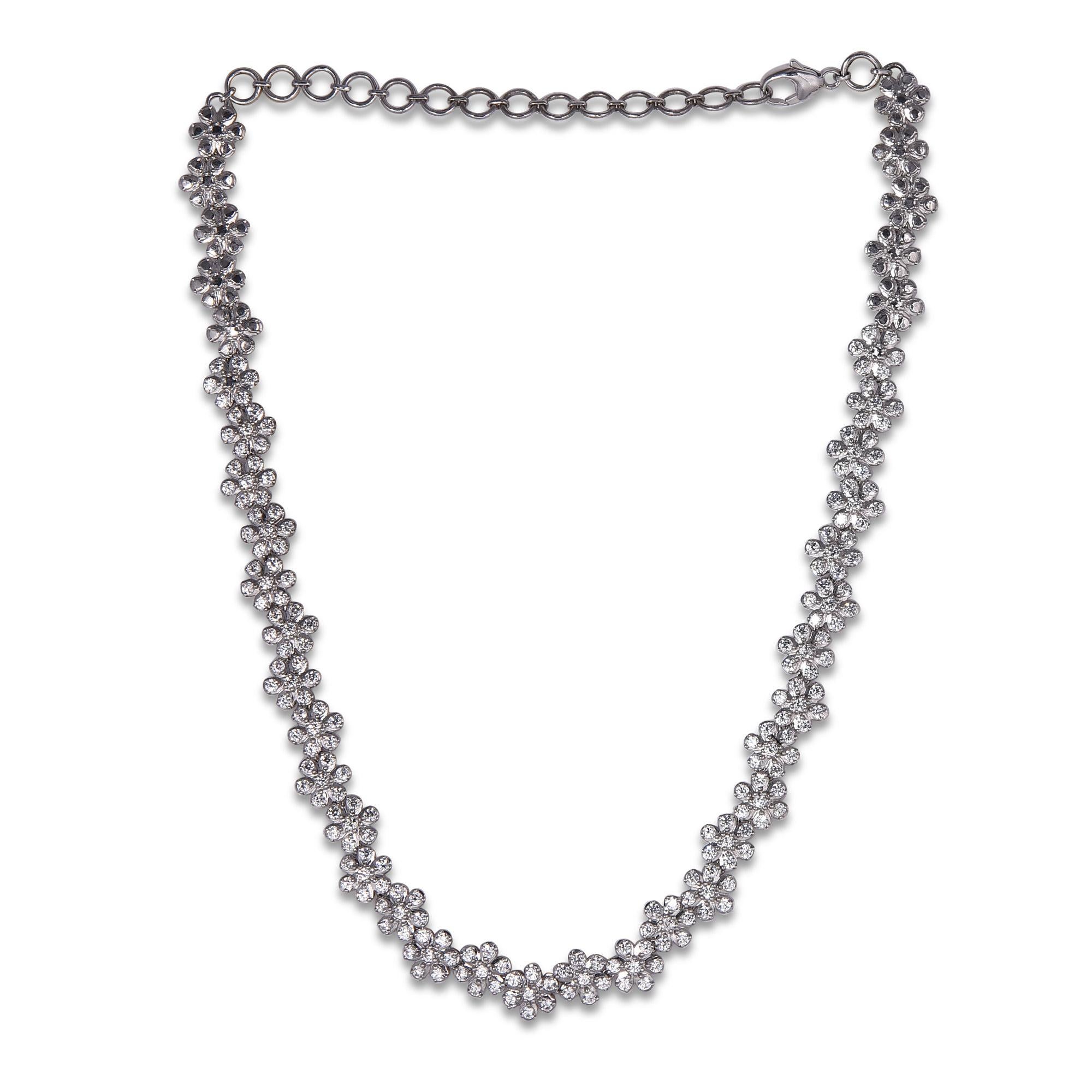 Bring charm to your look with this diamond necklace. This necklace is crafted from 18-karat White gold and features Round Brilliant 208 white diamonds in Prong set, H-I color I1 clarity and a high polish finish complete the Brilliant  sophistication