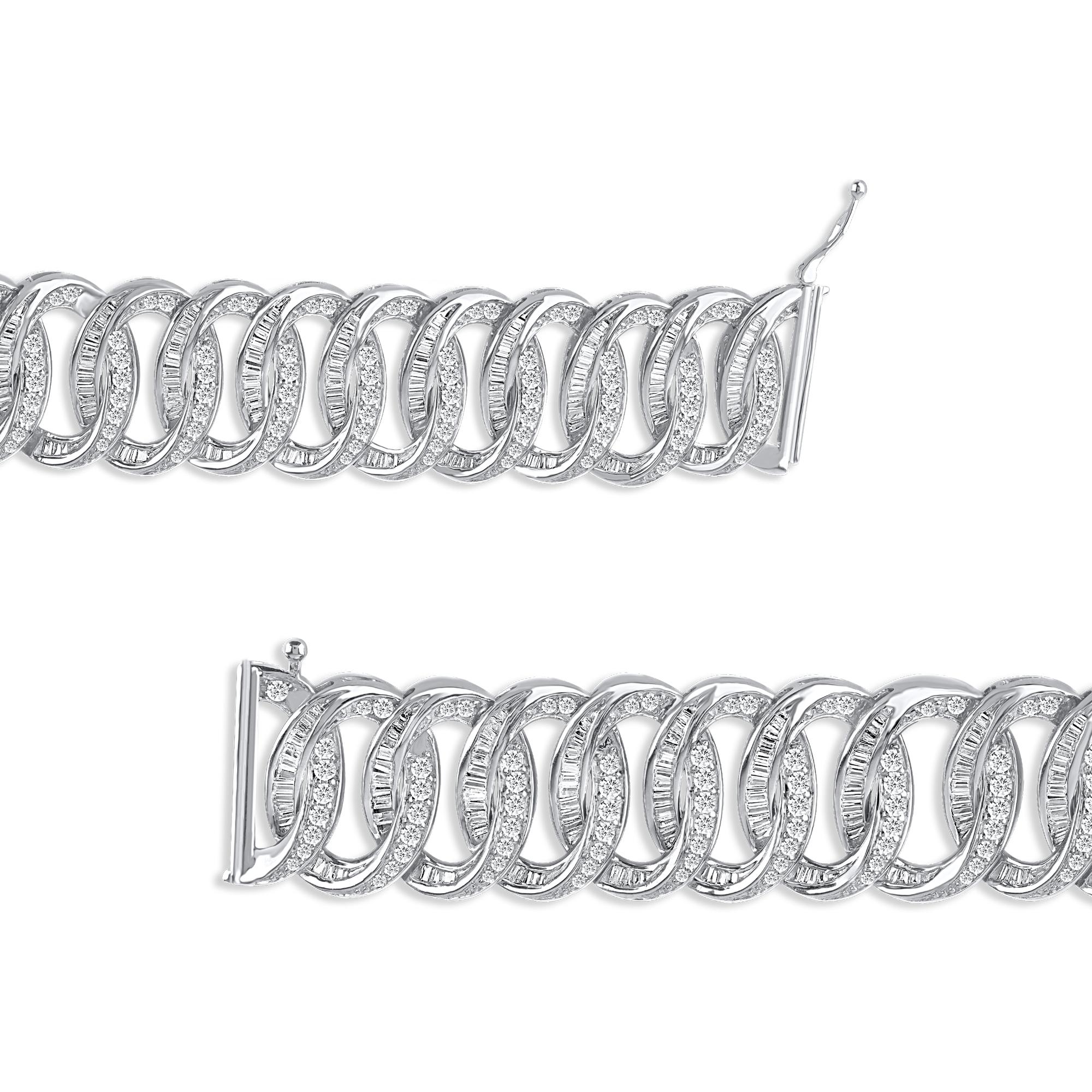 Express your sophisticated style with this gorgeous interlocking diamond bracelet. Expertly handcrafted by our inhouse experts in 14 karat white gold and studded with 480 brilliant cut and baguette diamond set in prong and channel setting. The total