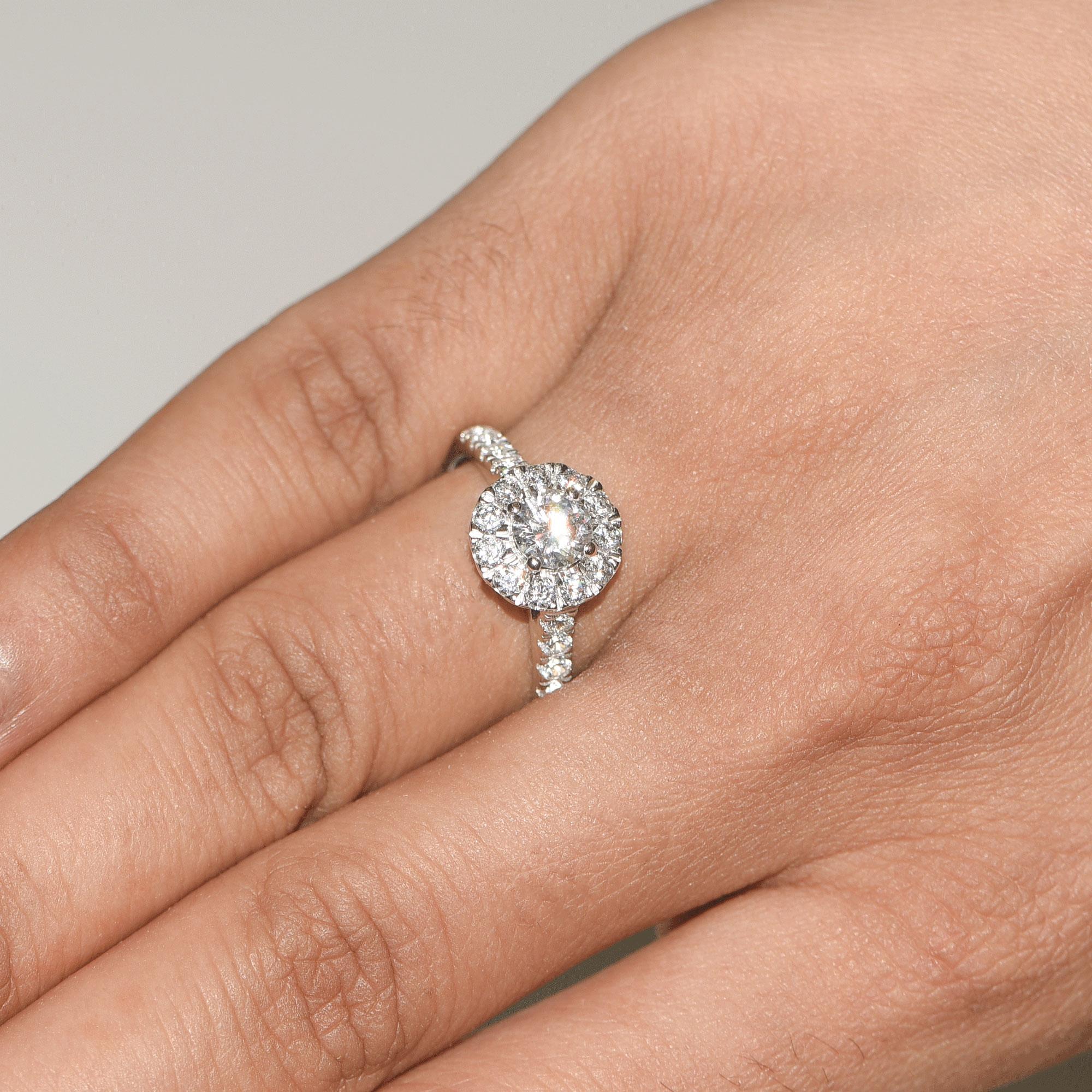 Round Cut TJD GIA Certified 1.25 Carat Diamond 18 Karat White Gold Halo Engagement Ring For Sale