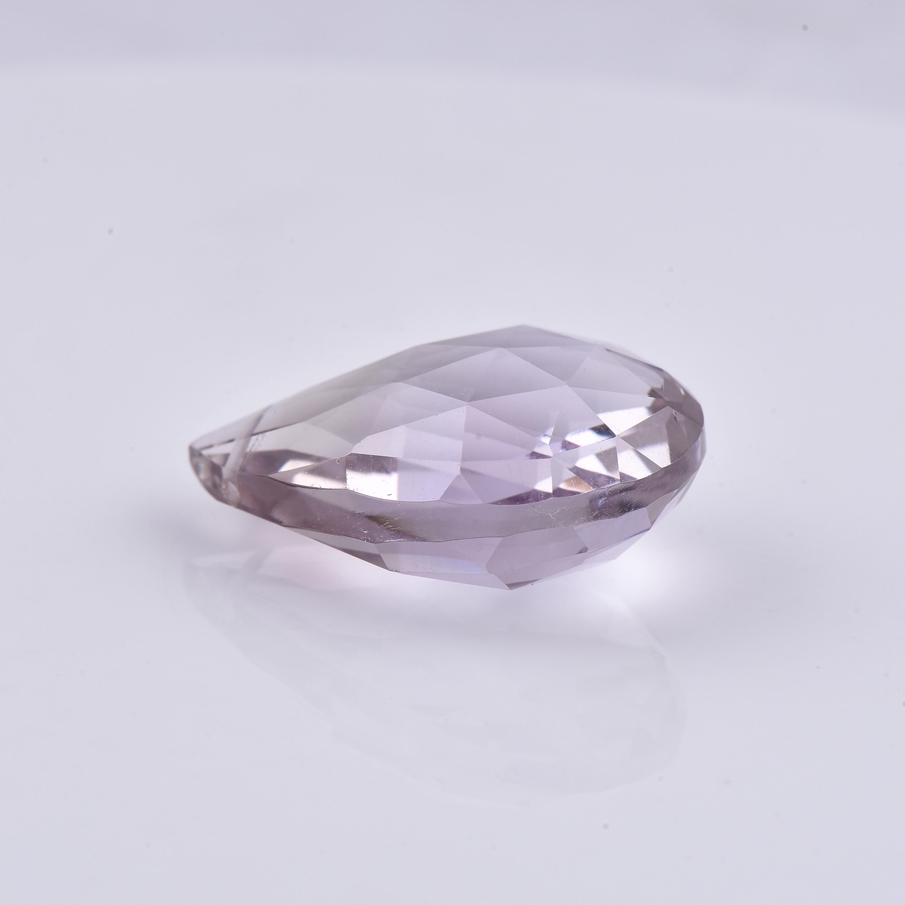Stone Information: Natural Amethyst
Shape/Cut: Pear Shape
Color: Reddish Purple/Purple
Dimensions (mm): 18.88 x 12.88 x 8.26
Weight: 11.55ct