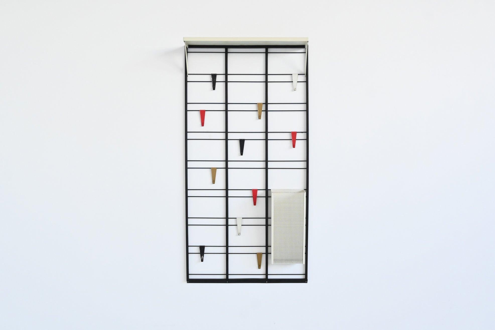 Fantastic playful and minimalistic “Servo Muto” wall mounted coat rack designed by Tjerk Reijenga for Pilastro, The Netherlands 1960. The “Servo Muto” coat rack is a prime example of mid-century modern design. This piece stands out for its