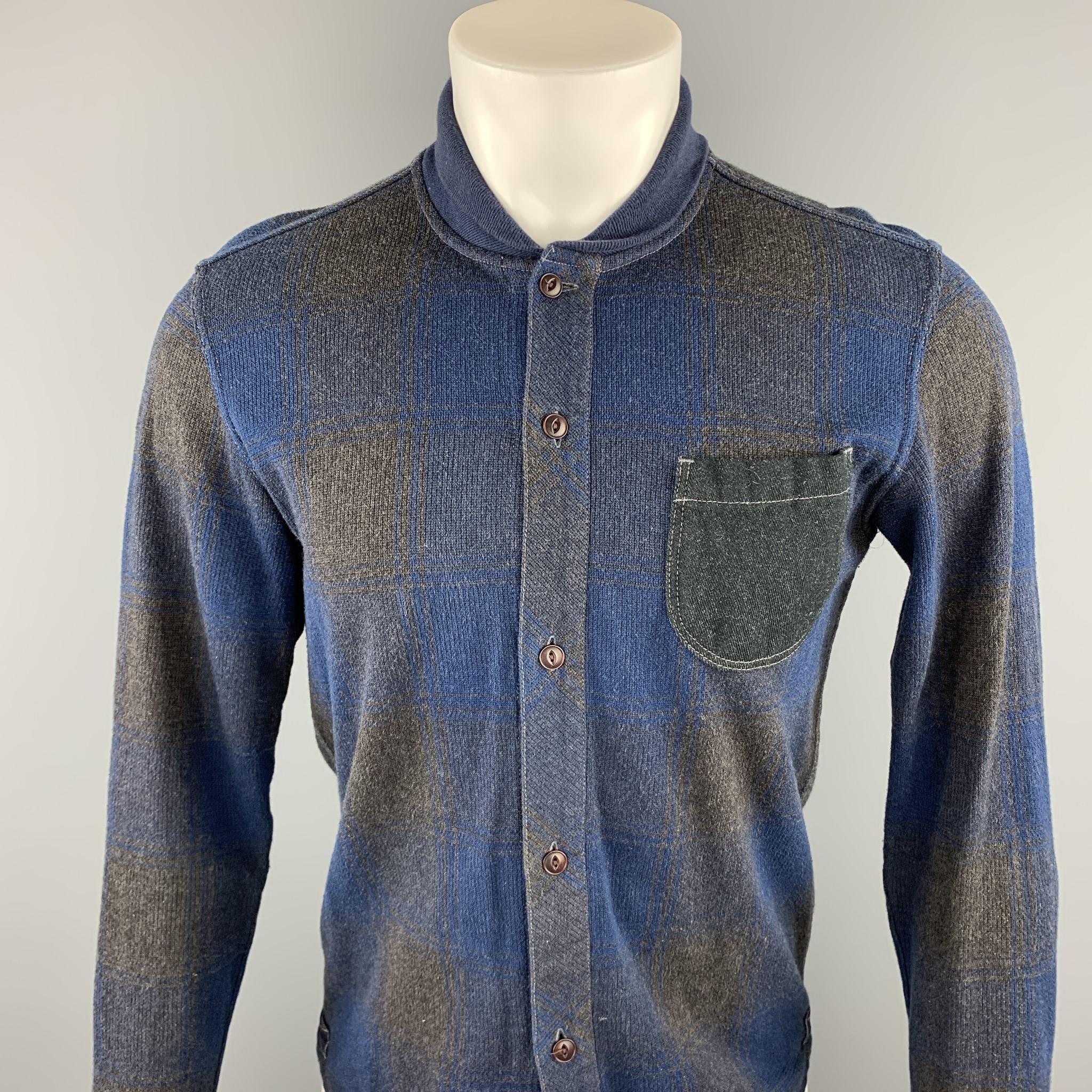 JUNYA WATANABE Comme des Garcons MAN shirt comes in a navy & gray plaid cotton featuring a jacket button up style, contrast stitching, elbow patch detail, front patch pocket, and a knitted stand up collar. Made in Japan.

Excellent Pre-Owned