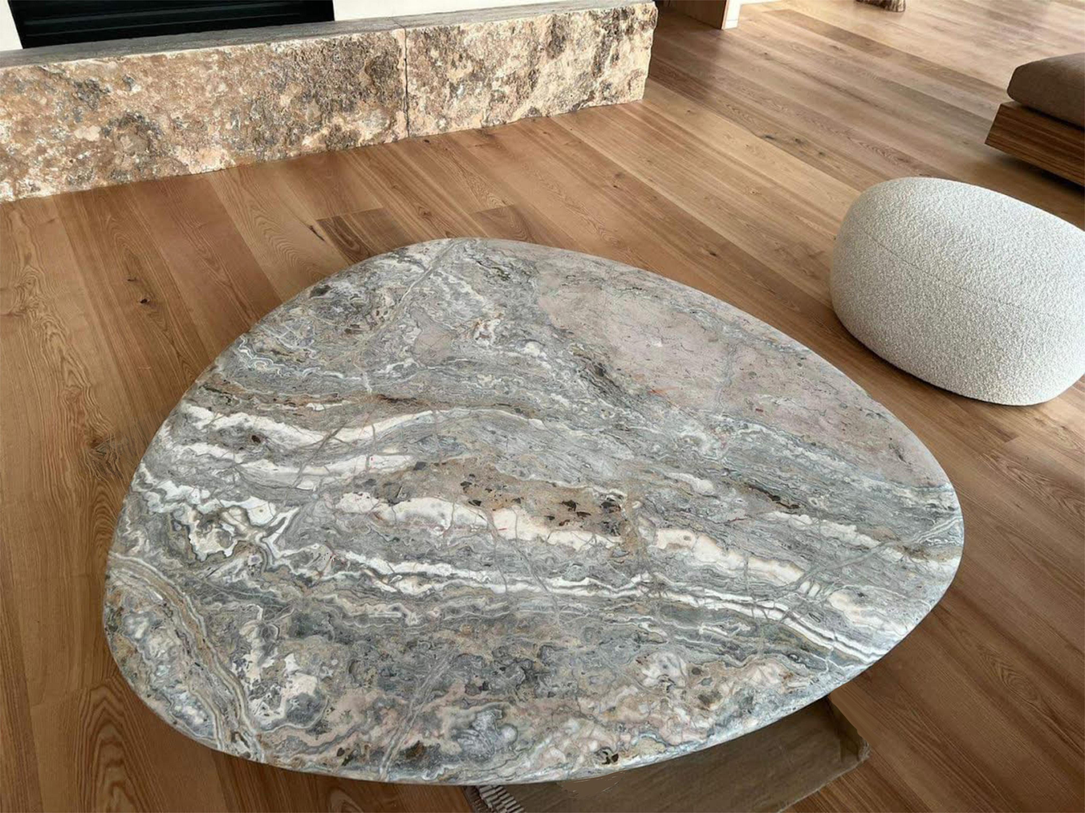 Tinatin Kilaberidze
Skimming Stone Coffee Table, 2022
Terra Onyx Stone top, legs in medium stained wood
140 x 140 x 140 cm
63 x 63 x 63 in
11.5 in overall H (12.5 OH possible), 2.75 slab H at edges , 8.75 leg H 
Thickness in the middle of the slab
