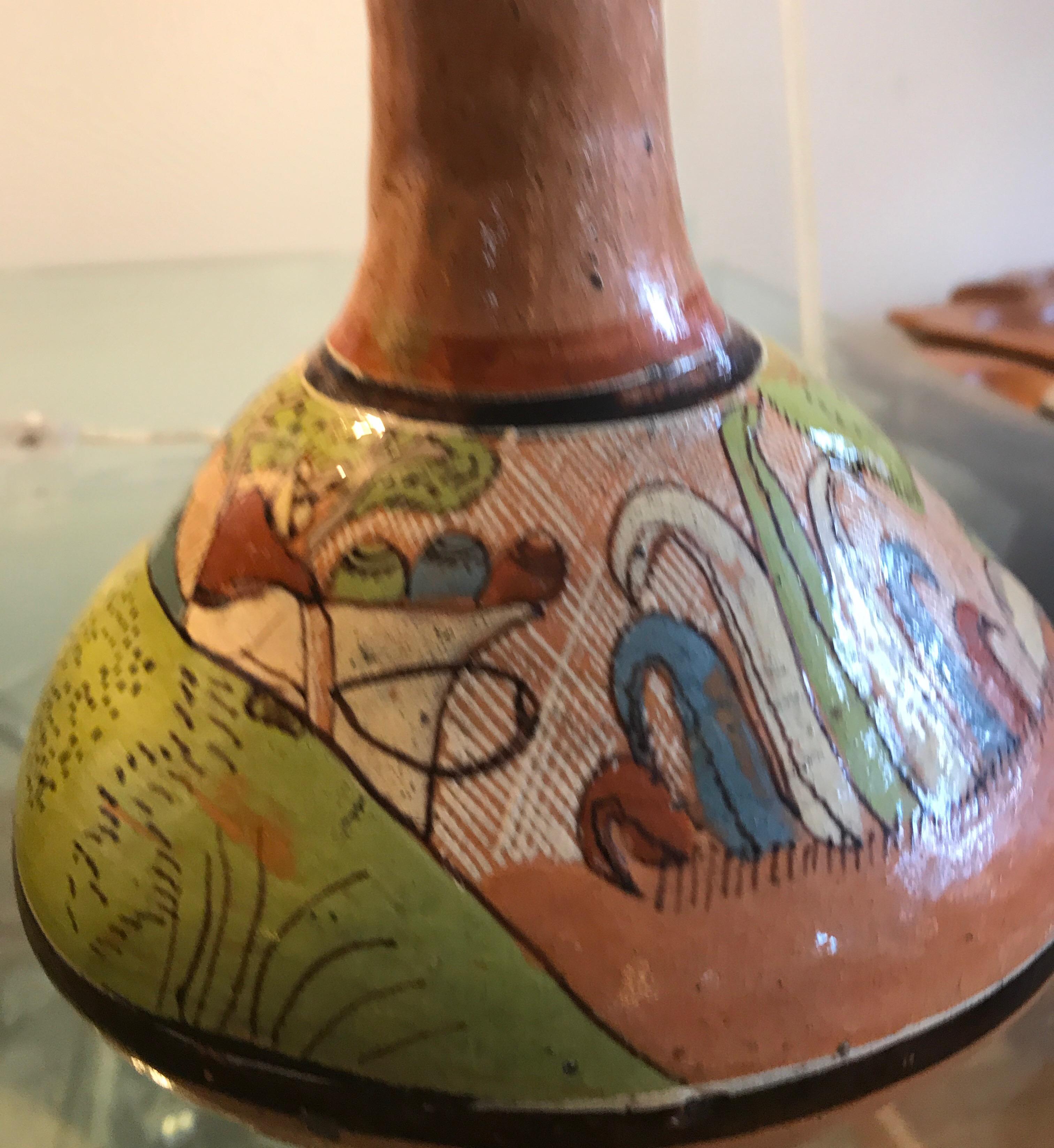 Mexican hand painted Tlaquepaque ceramic vase. The vessel is hand decorated with cacti, aloe, and the Mexican landscape.