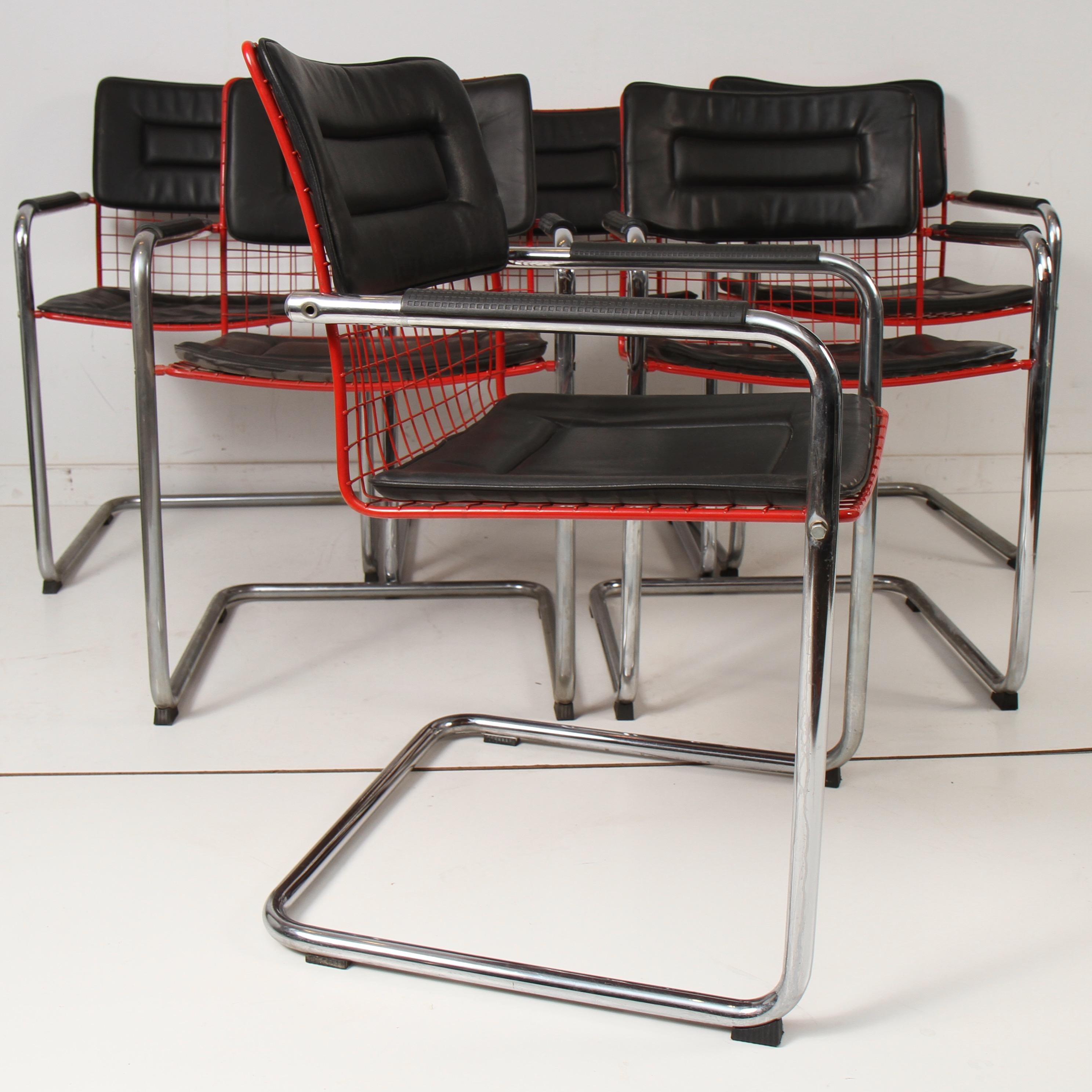 Clean set of 6 chairs with Naugahyde snap on cushions and red powder-coated wire seats with chrome arms and cantilevered legs. Very much in the style of Italian furniture maker TMU.