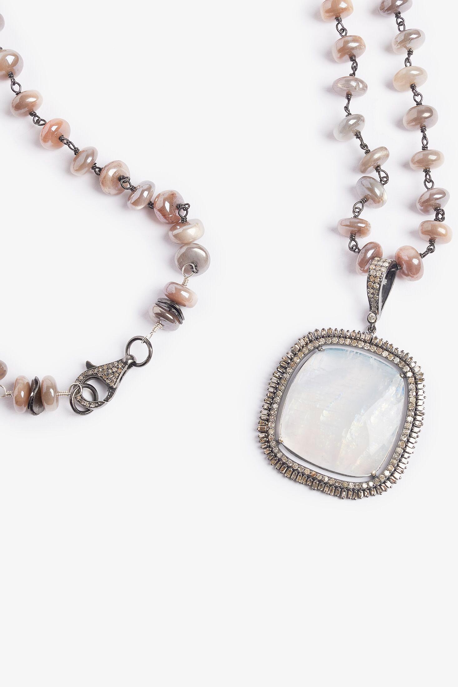 Story Behind the Jewelry
Love takes you to the moon and back just like this unique one-of-a-kind necklace.  The beautiful moonstone pendant has hues of the rainbow and encased in pave diamonds.  The necklace is adorned with iridescent moonstone and