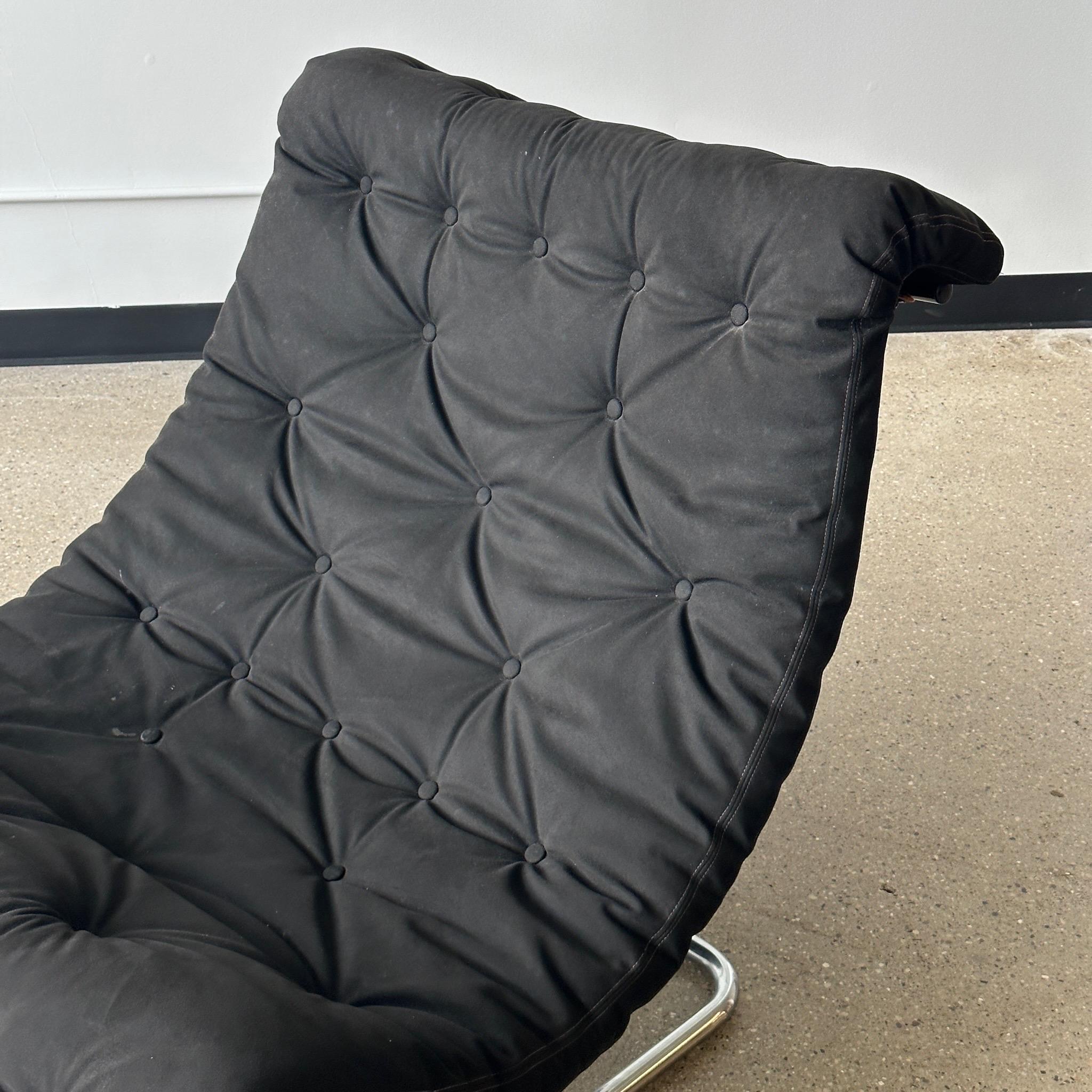 c. 1970s. Black sling on chrome base. Made in Sweden. 

