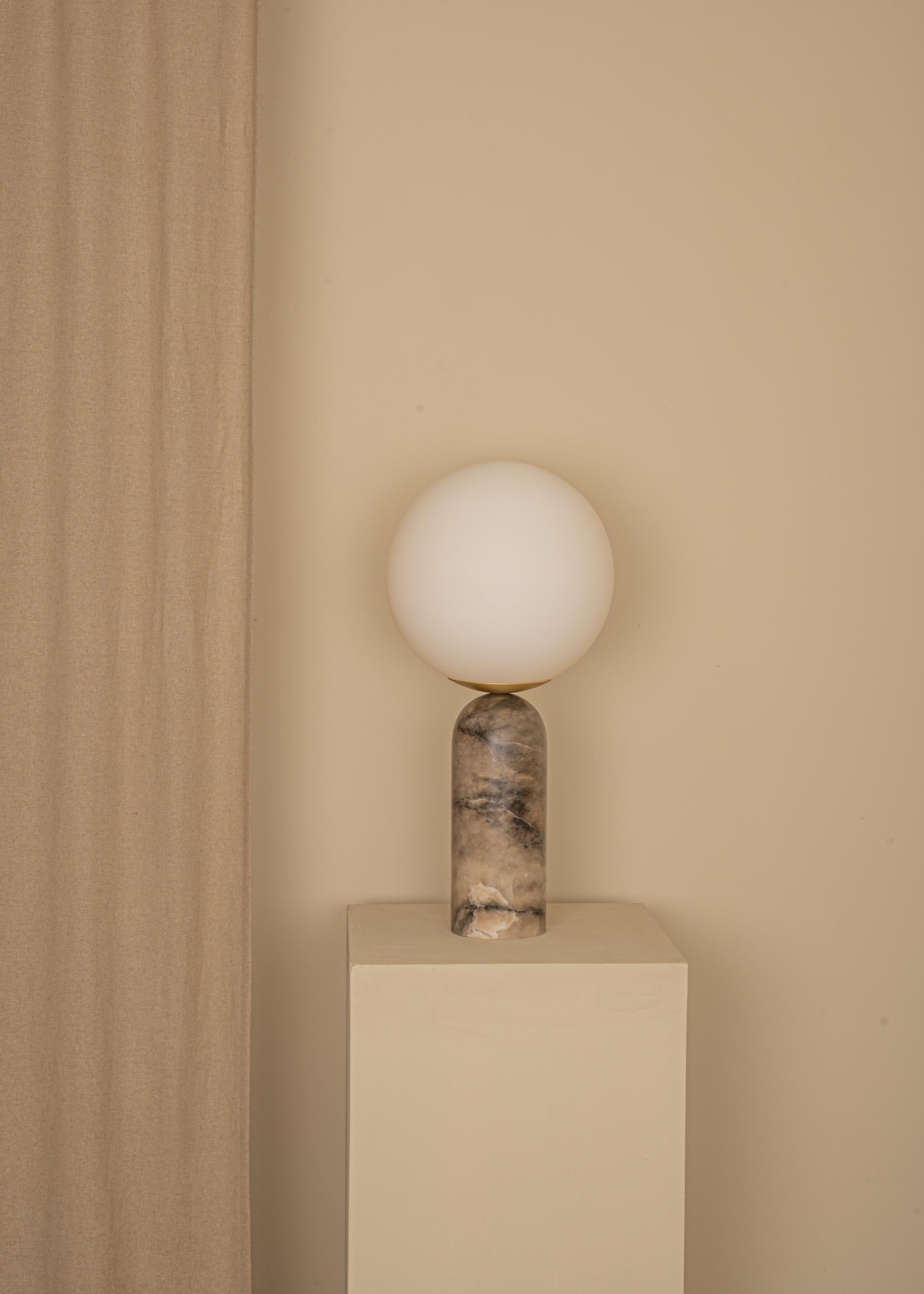 Tobacco Alabaster and Brass Atlas Table Lamp by Simone & Marcel
Dimensions: Ø 30 x H 60 cm.
Materials: Glass, brass and white alabaster.

Also available in different marble, wood and alabaster options and finishes. Custom options available on