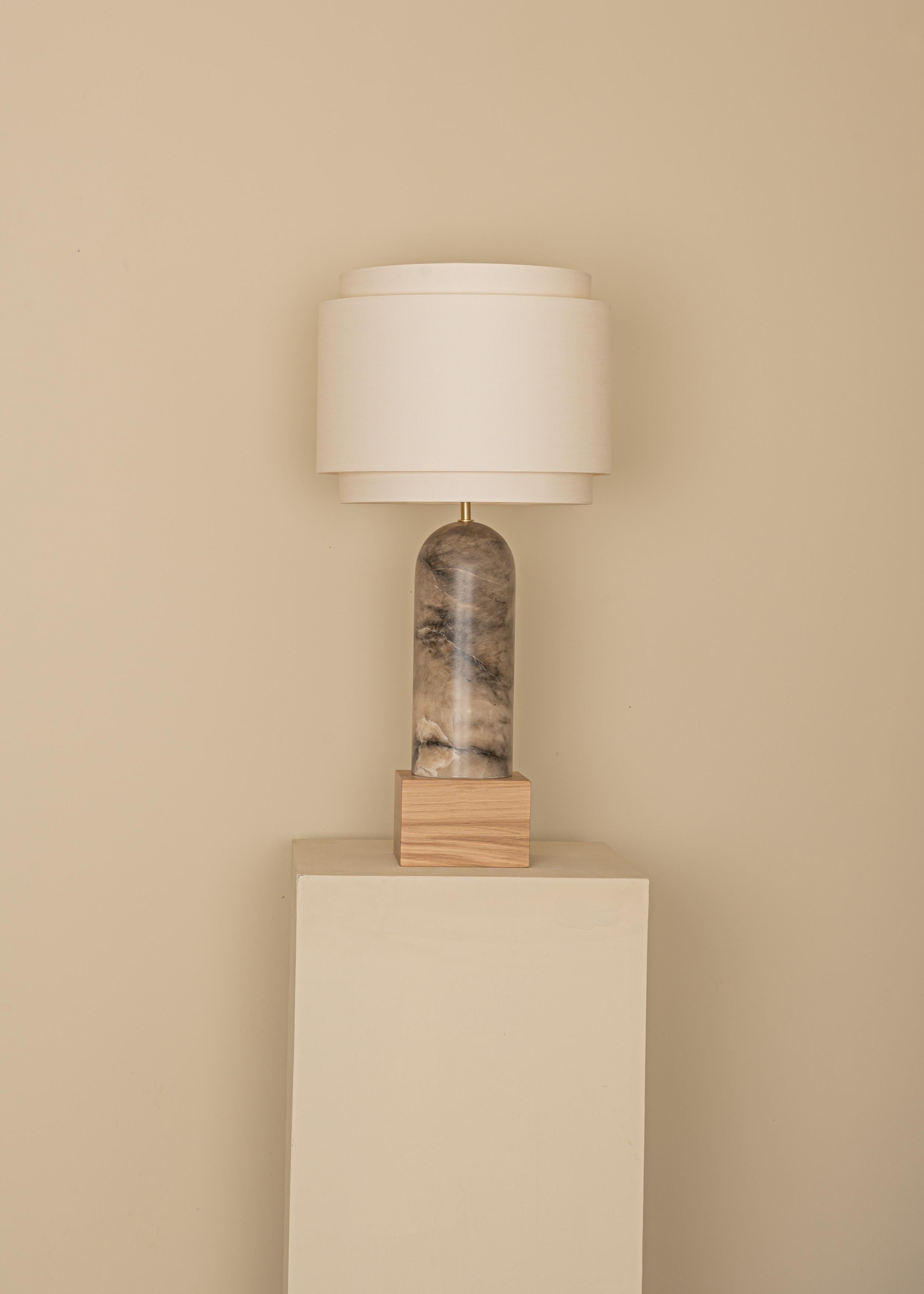 Tobacco Alabaster And Oak Base Pura Kelo Double Table Lamp by Simone & Marcel
Dimensions: D 35 x W 35 x H 69 cm.
Materials: Brass, cotton, oak and tobacco alabaster.

Also available in different marble, wood and alabaster options and finishes.