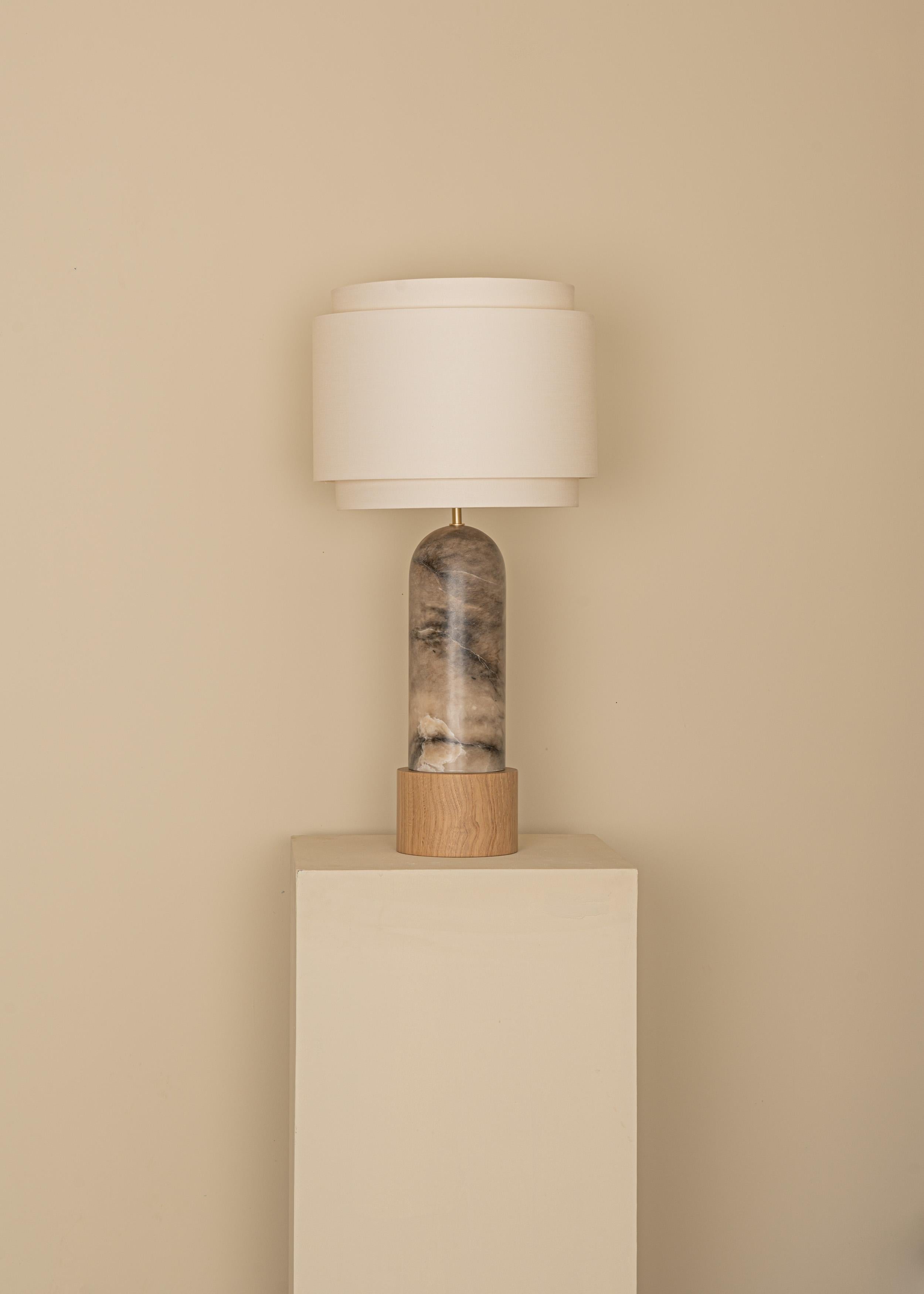 Tobacco Alabaster And Oak Base Pura Kelo Double Table Lamp by Simone & Marcel
Dimensions: D 35 x W 35 x H 69 cm.
Materials: Brass, cotton, oak and tobacco alabaster.

Also available in different marble, wood and alabaster options and finishes.