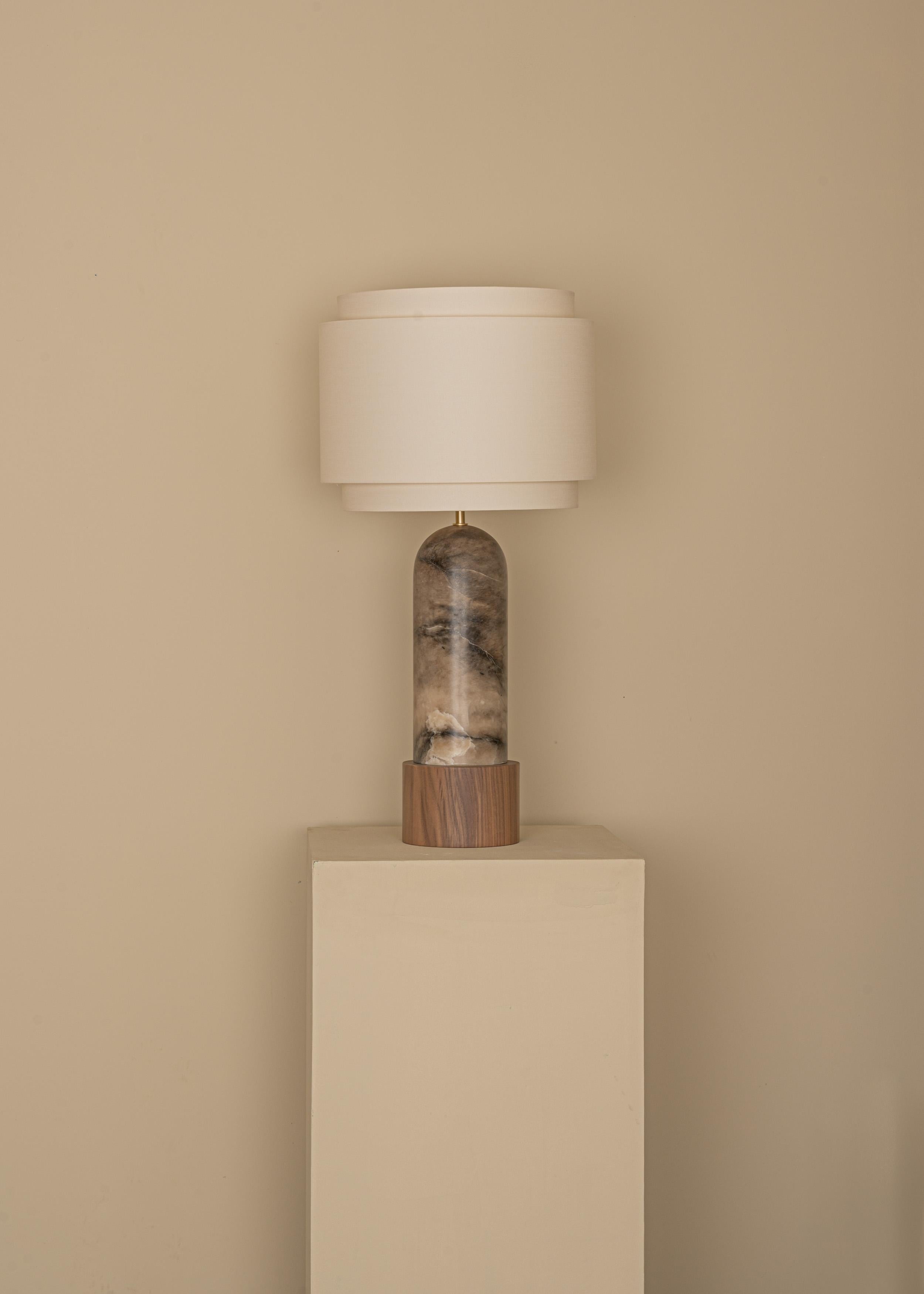 Tobacco Alabaster And Walnut Base Pura Kelo Double Table Lamp by Simone & Marcel
Dimensions: D 35 x W 35 x H 69 cm.
Materials: Brass, cotton, walnut and tobacco alabaster.

Also available in different marble, wood and alabaster options and finishes.