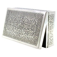 Tobacco box in embossed silver with Asian motifs and wood-lined interior