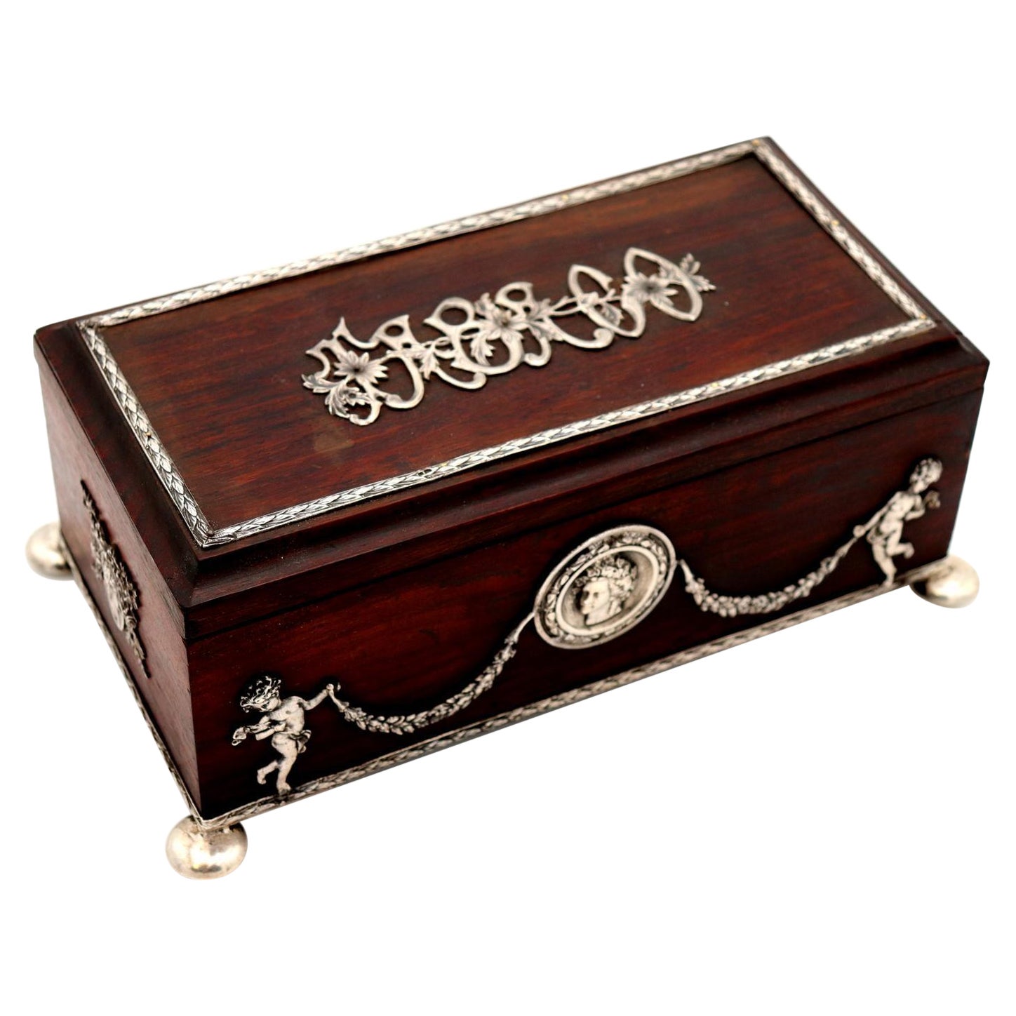 Tobacco box in rosewood with silver applications