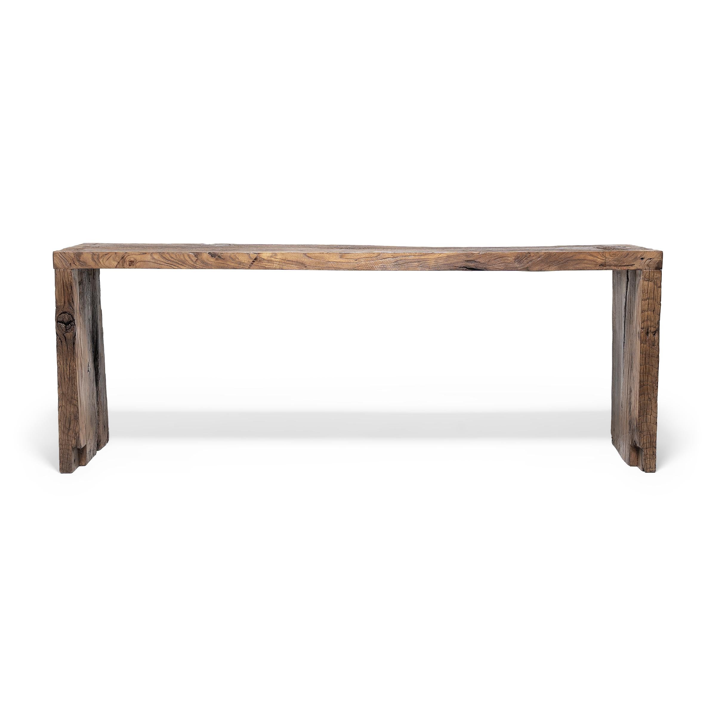 Made of wood reclaimed from 18th-century Chinese buildings, this contemporary altar table honors the materials with clean lines and minimal ornamentation. Embracing the notion of “wabi-sabi,” the table charms with its irregular surface, mottled
