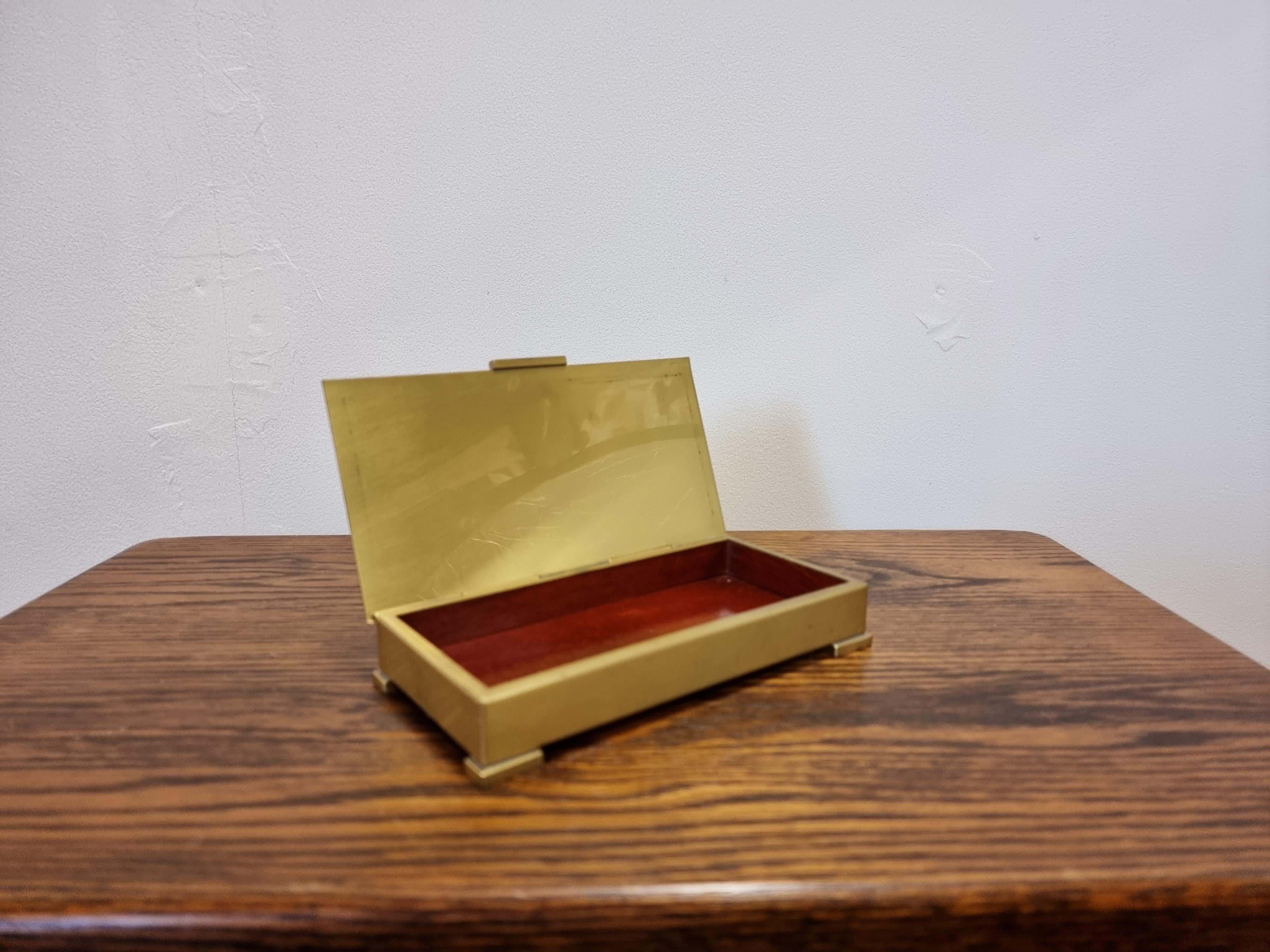 A rare tobacco / cigar / decorative box by Ystad Metall (1833-1969) in brass with wood interior. 

Sweden mid-1900s. In good condition, with patina. Smaller signs of wear and age. One smaller bent corner. Can be polished. 

A perfect to