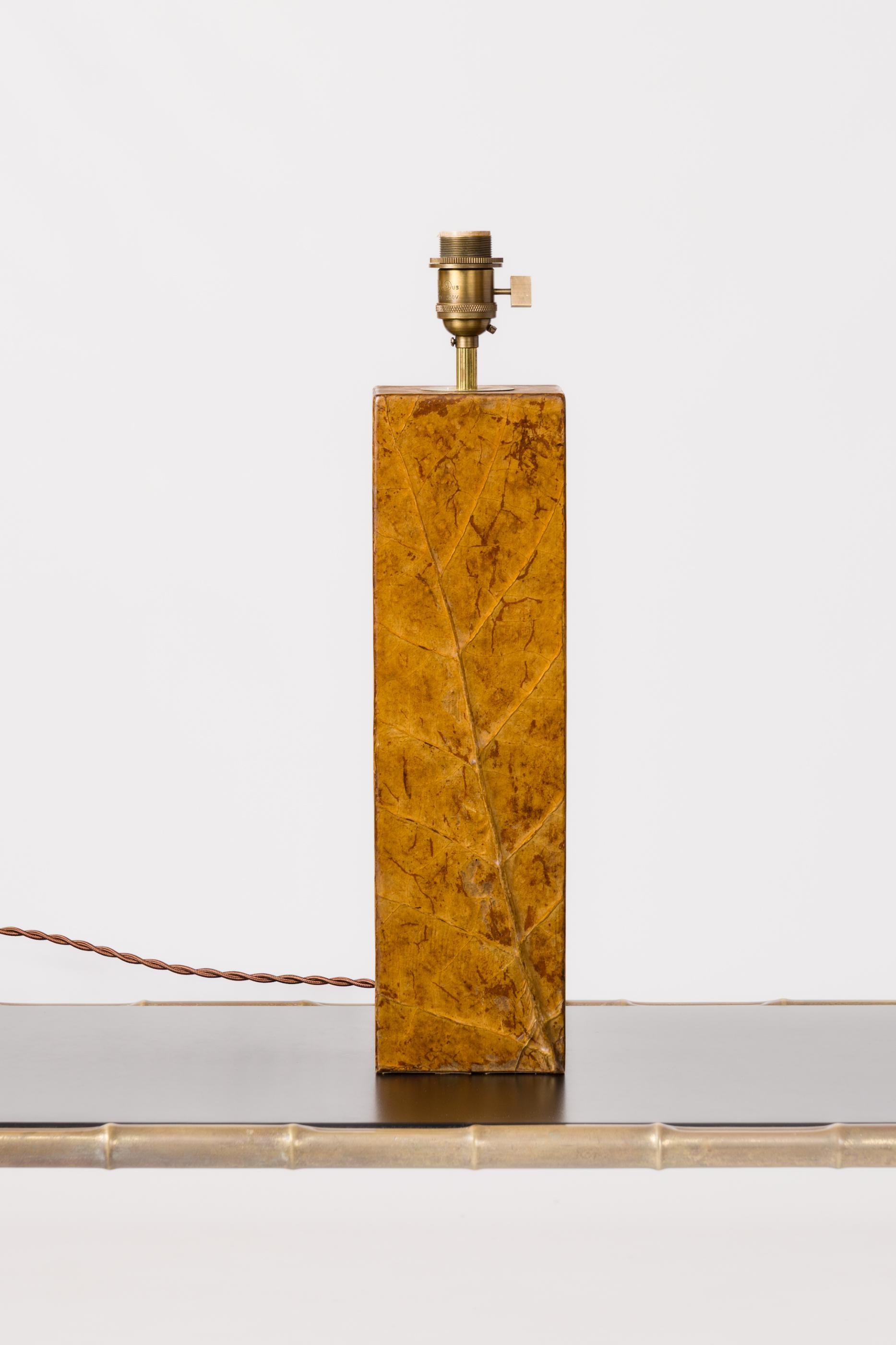 Decorative lamp, wooden structure covered with tobacco leaf appliqué, covered with transparent resin. France, 1970s.
In fair vintage condition.
Rewired for use in the US.
This lamp will ship from France and can be returned to either France or to an