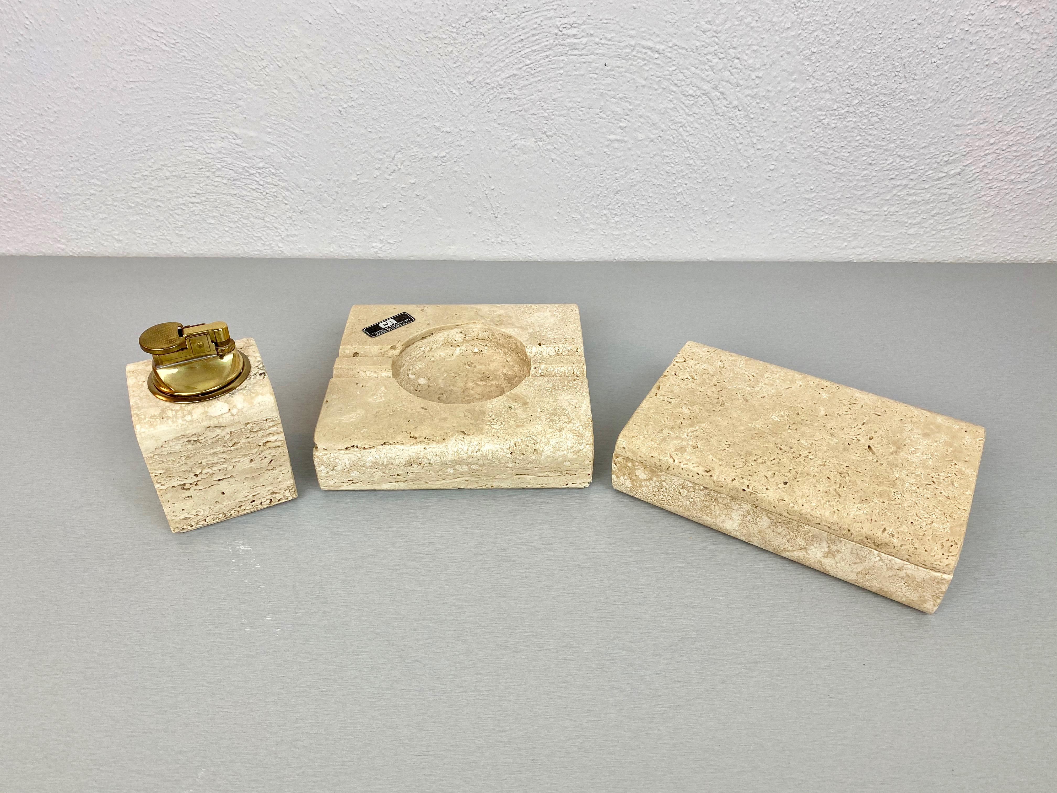 Tobacco set in travertine marble composed of ashtray, lighter and box by the Italian designer Cerri Nestore, 1970s. 

The original label is still attached on the ashtray. and, in addition, the set comes with its original box.