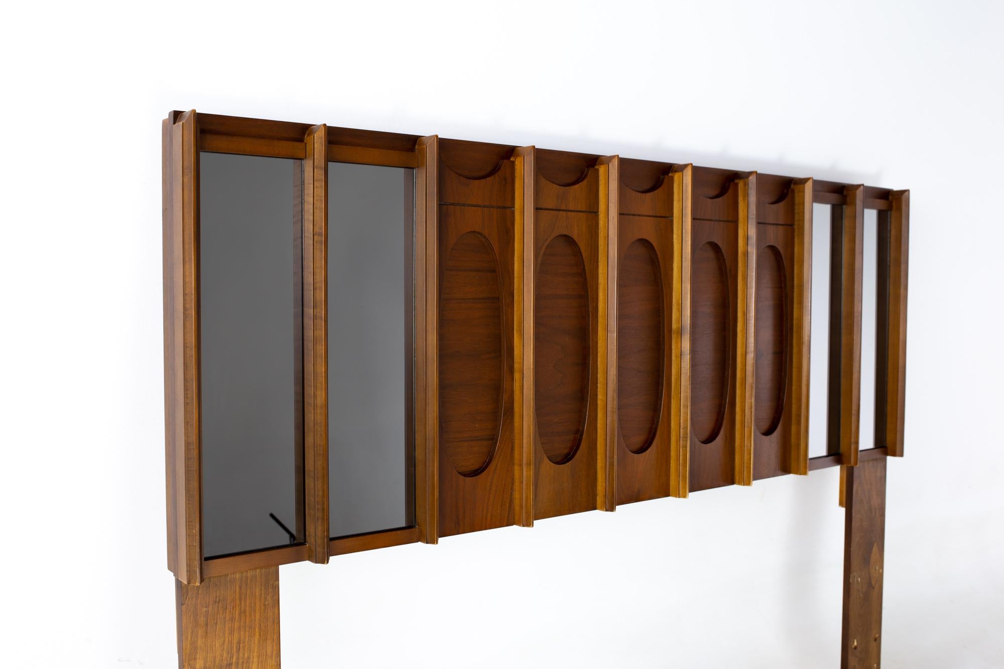 Tobago brutalist mid century walnut and mirror Queen storage headboard
Headboard measures: 60 wide x 4 deep x 44.5 inches high

All pieces of furniture can be had in what we call restored vintage condition. That means the piece is restored upon