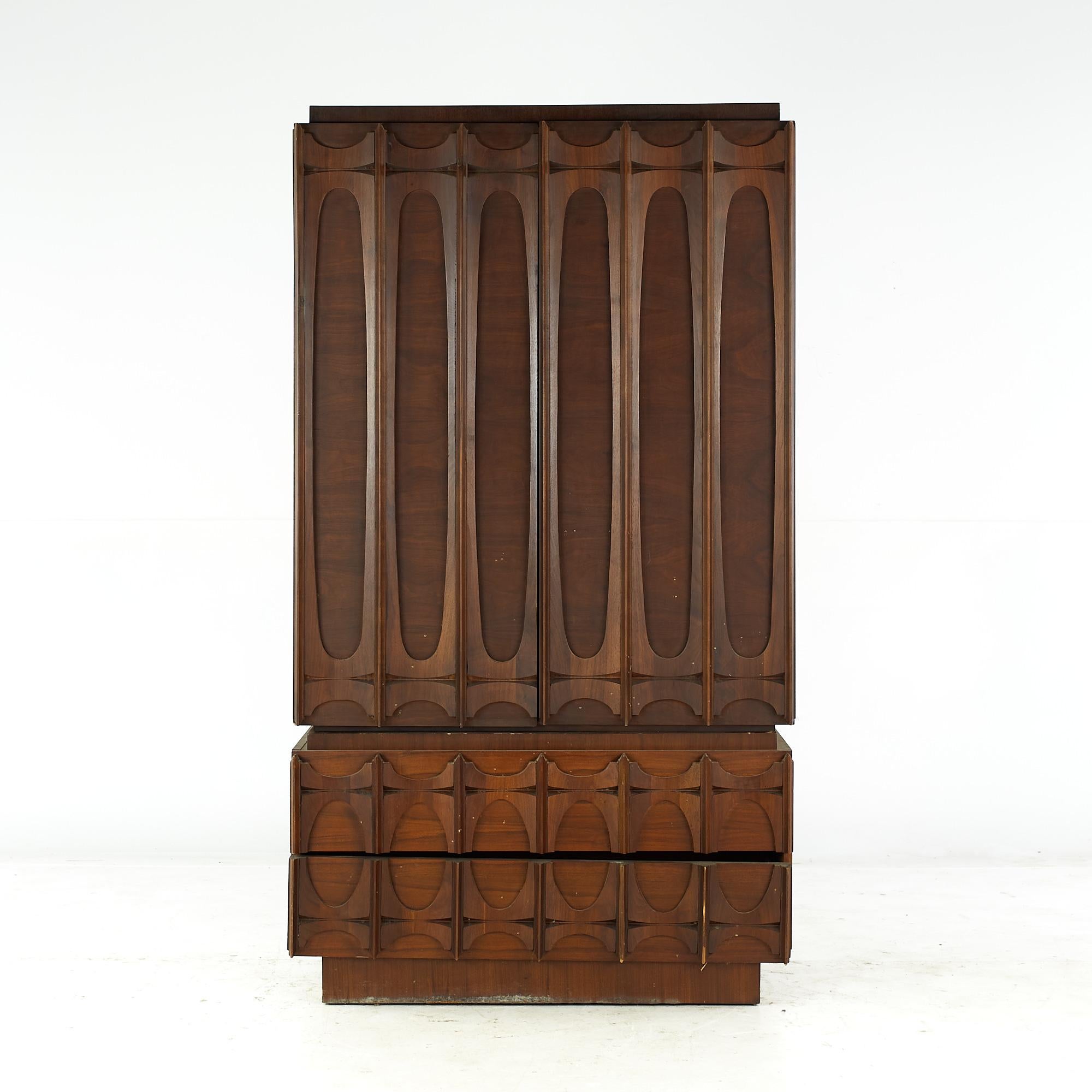 Tobago Brutalist Mid Century Walnut Armoire Highboy Dresser

This highboy measures: 40.5 wide x 21.5 deep x 72 inches high

All pieces of furniture can be had in what we call restored vintage condition. That means the piece is restored upon