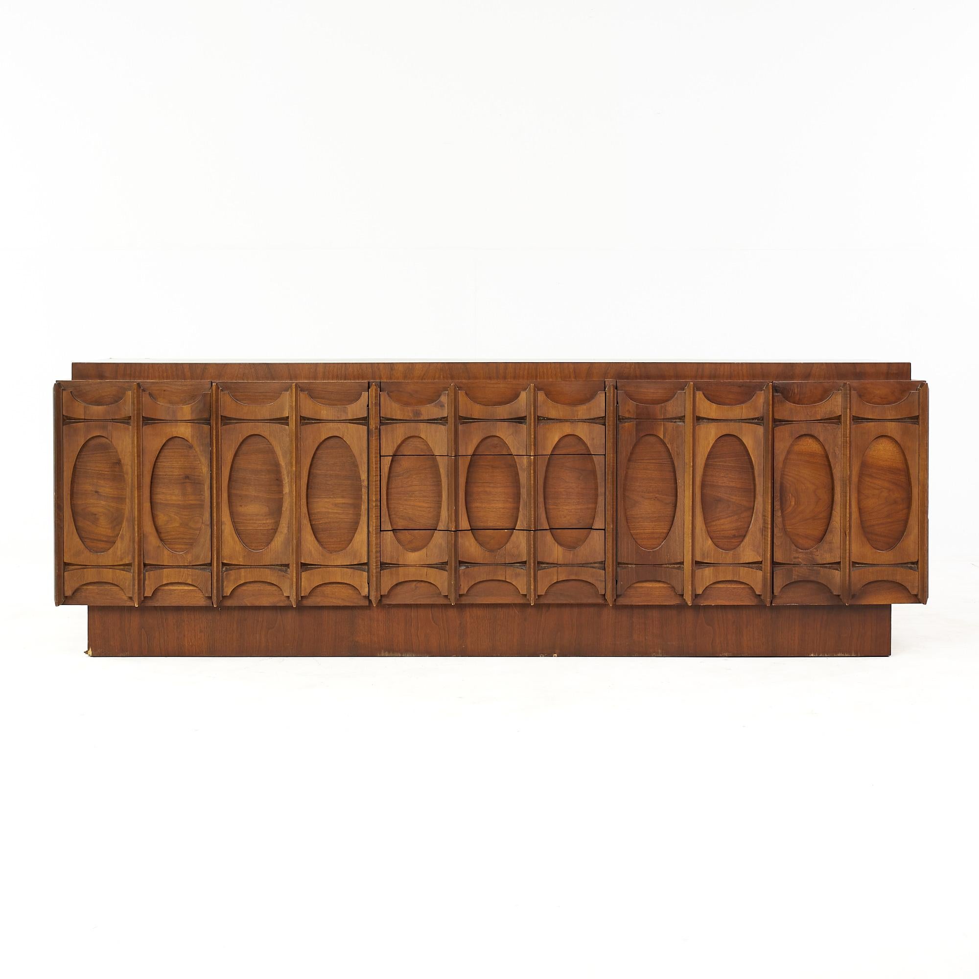 Tobago Brutalist Mid Century Walnut Credenza

This credenza measures 73 wide x 18 deep x 30 inches high

All pieces of furniture can be had in what we call restored vintage condition. That means the piece is restored upon purchase so it’s free of